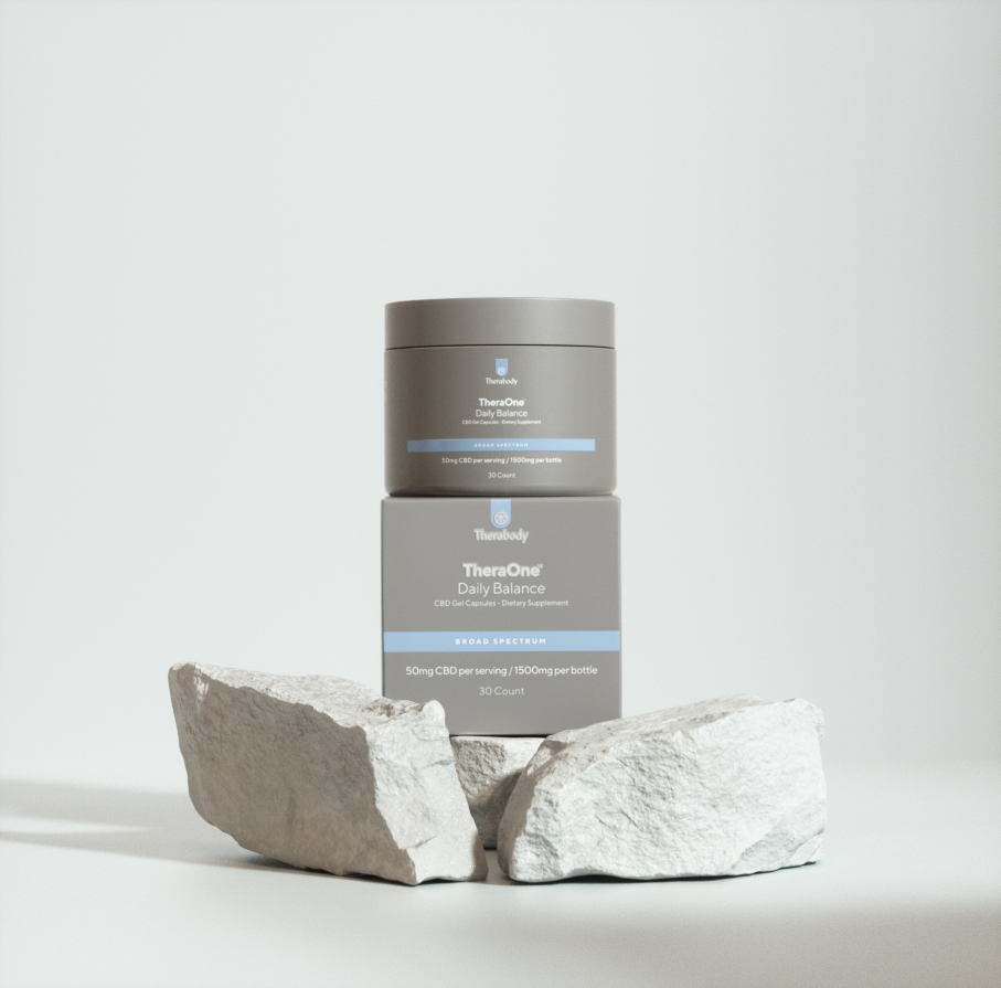 TheraCure Cream for Acne Treatment, a gray jar with blue label, atop a stone block on a white background.