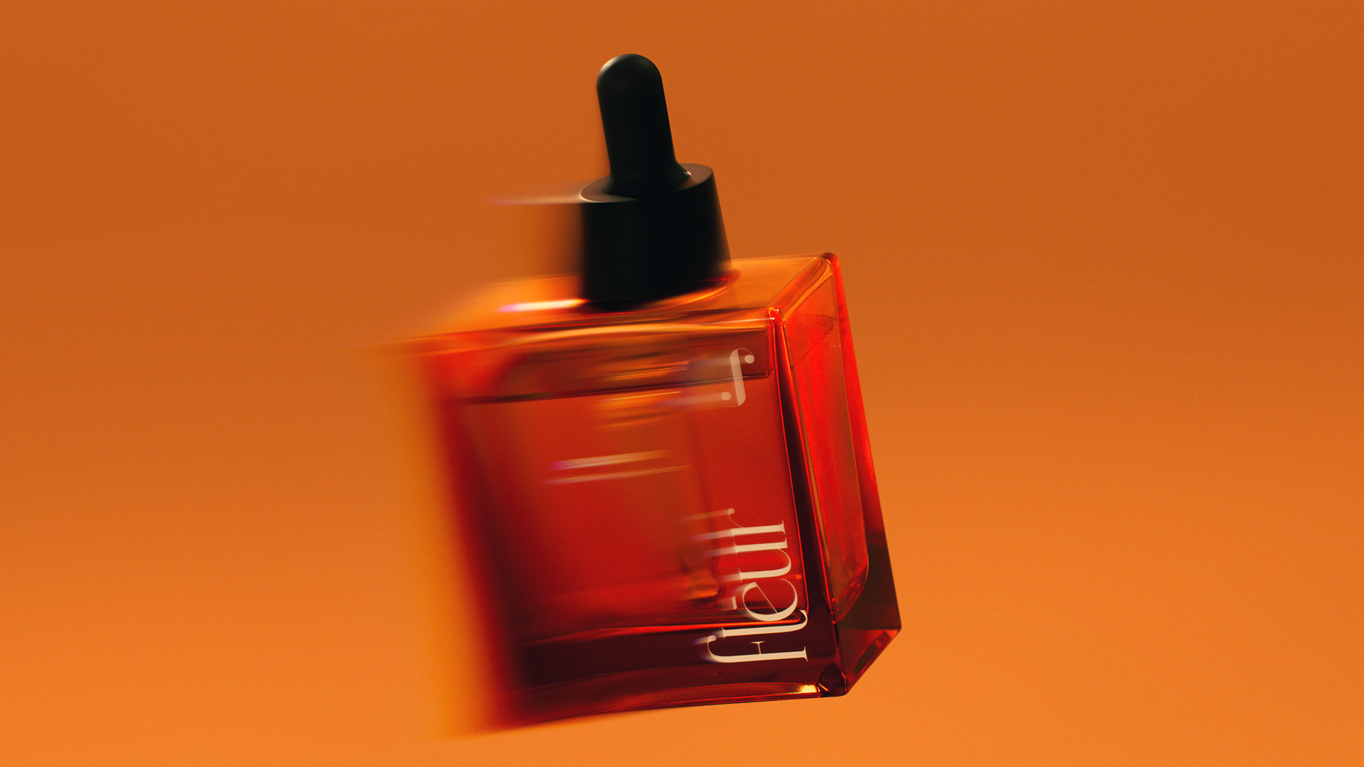 A clear glass bottle with a dropper cap on an orange background, showing the product's sleek design.