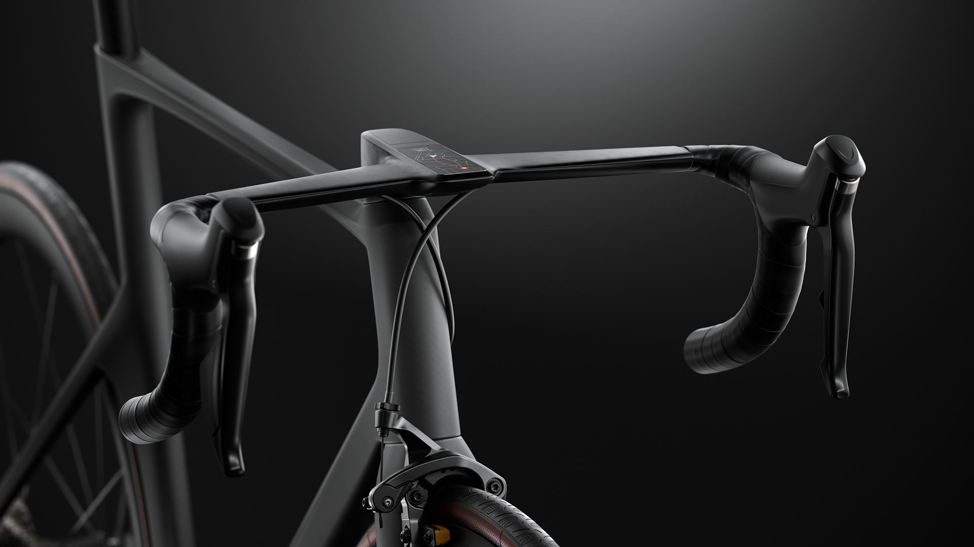 A sleek, black carbon fiber bicycle frame with ergonomic handlebars and a digital display on the stem.