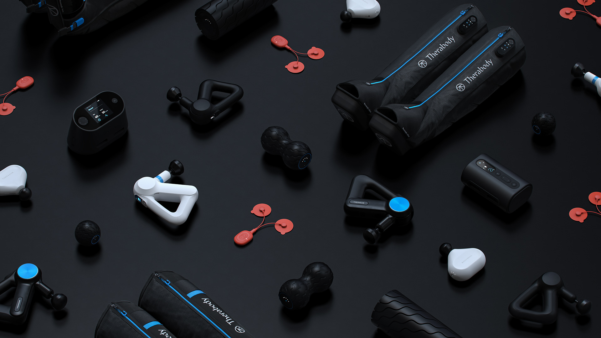 A collection of black and white fitness equipment including a Therabody RecoveryAir Jetboots, kettlebells, dumbbells, and resistance bands on a dark background.