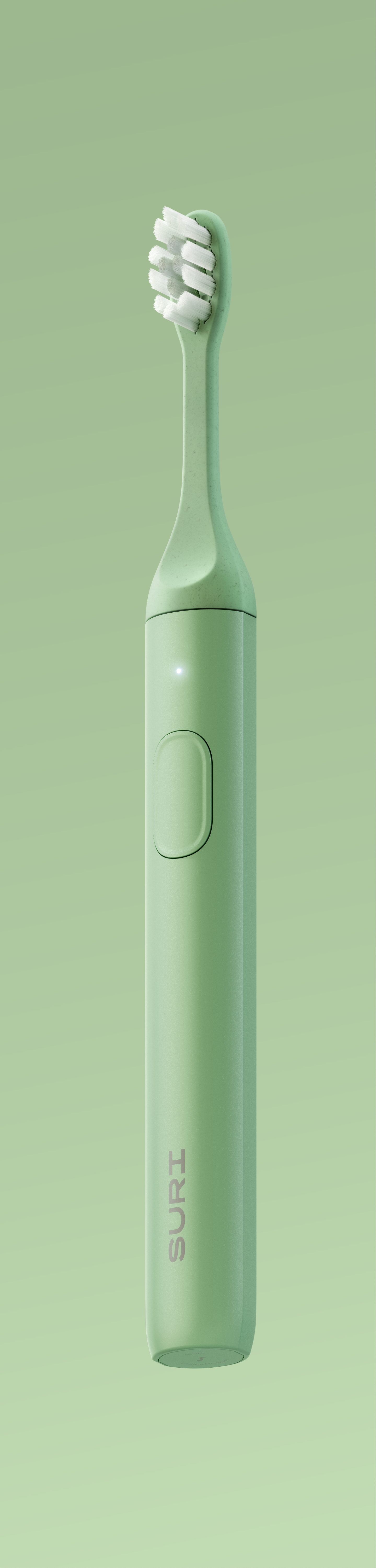 A mint green electric toothbrush with a sleek design, featuring a button on the side and the brand name "SURI" on the handle.