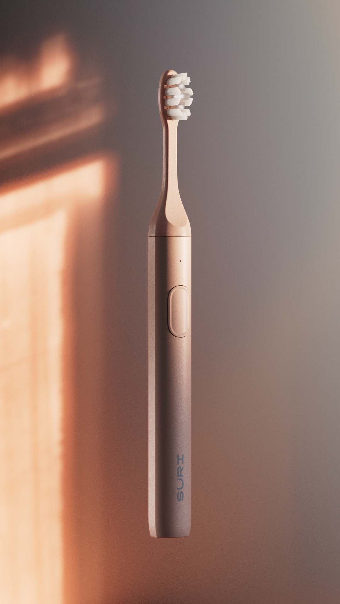 A electric toothbrush with a rose gold finish, featuring the brand name "SURI" on its side.