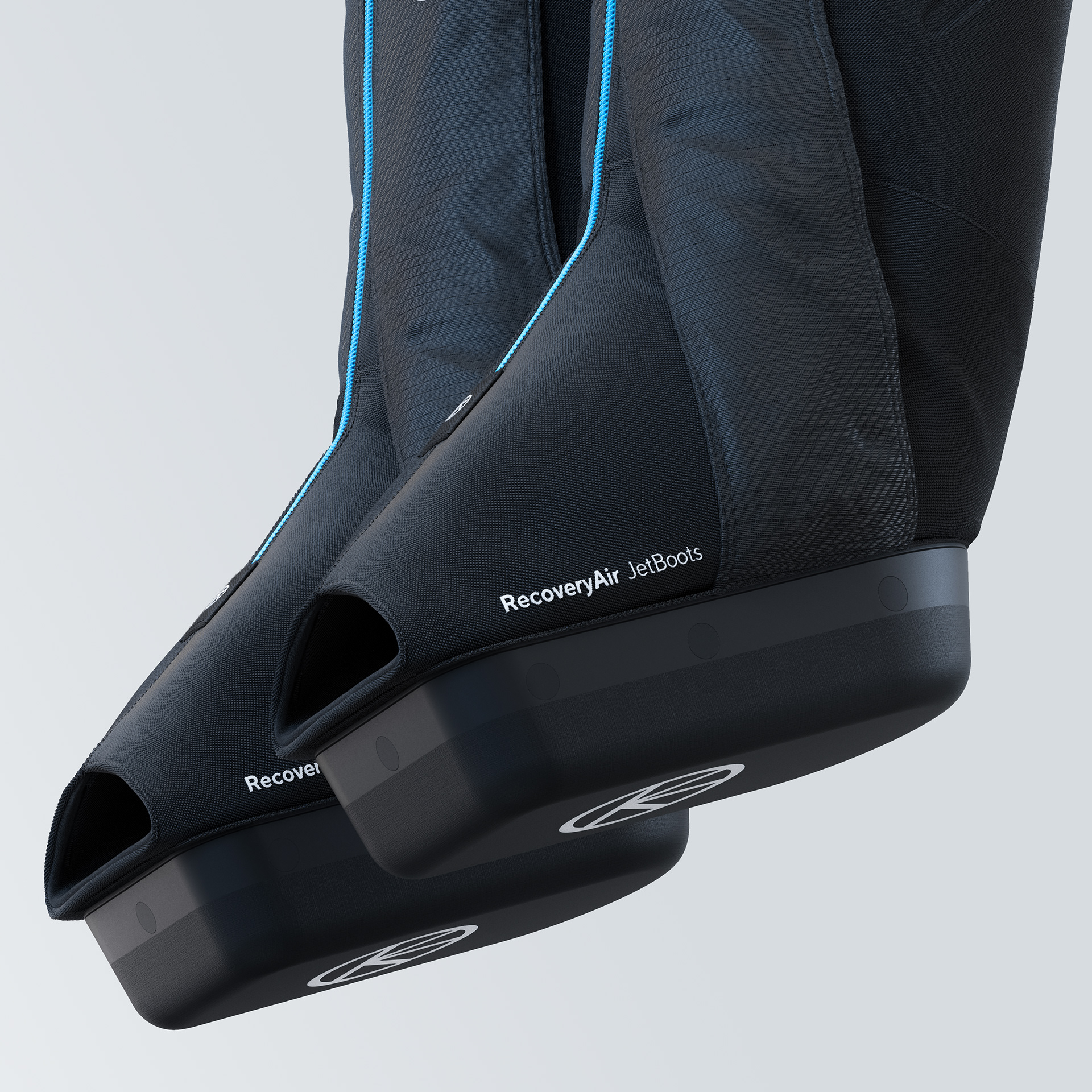 Close-up of black RecoveryAir JetBoots with blue accents and "RecoveryAir" branding on the side.