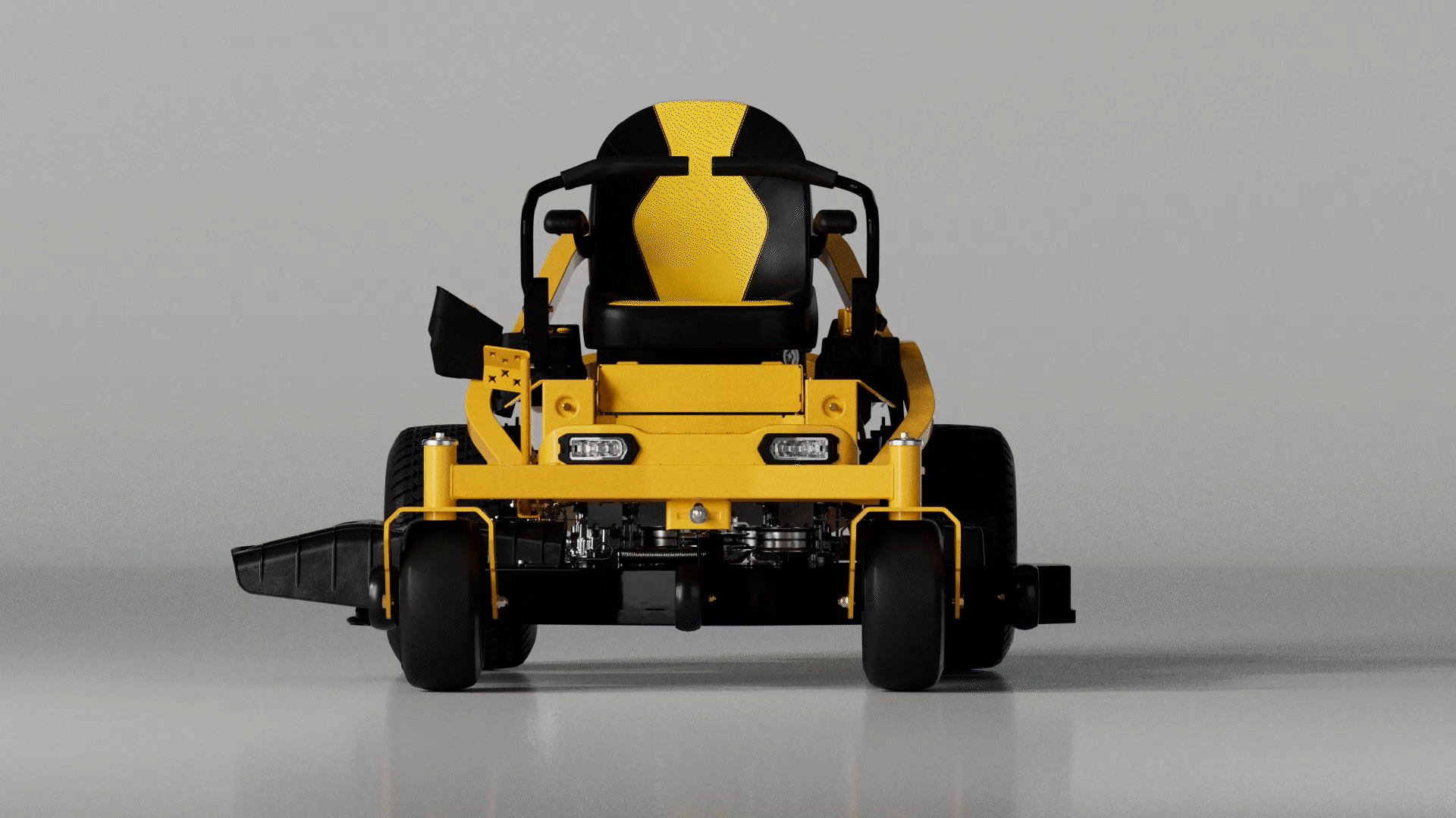 Animated sequence: A yellow and black lawn mower with a large engine and a steering wheel, viewed from behind.