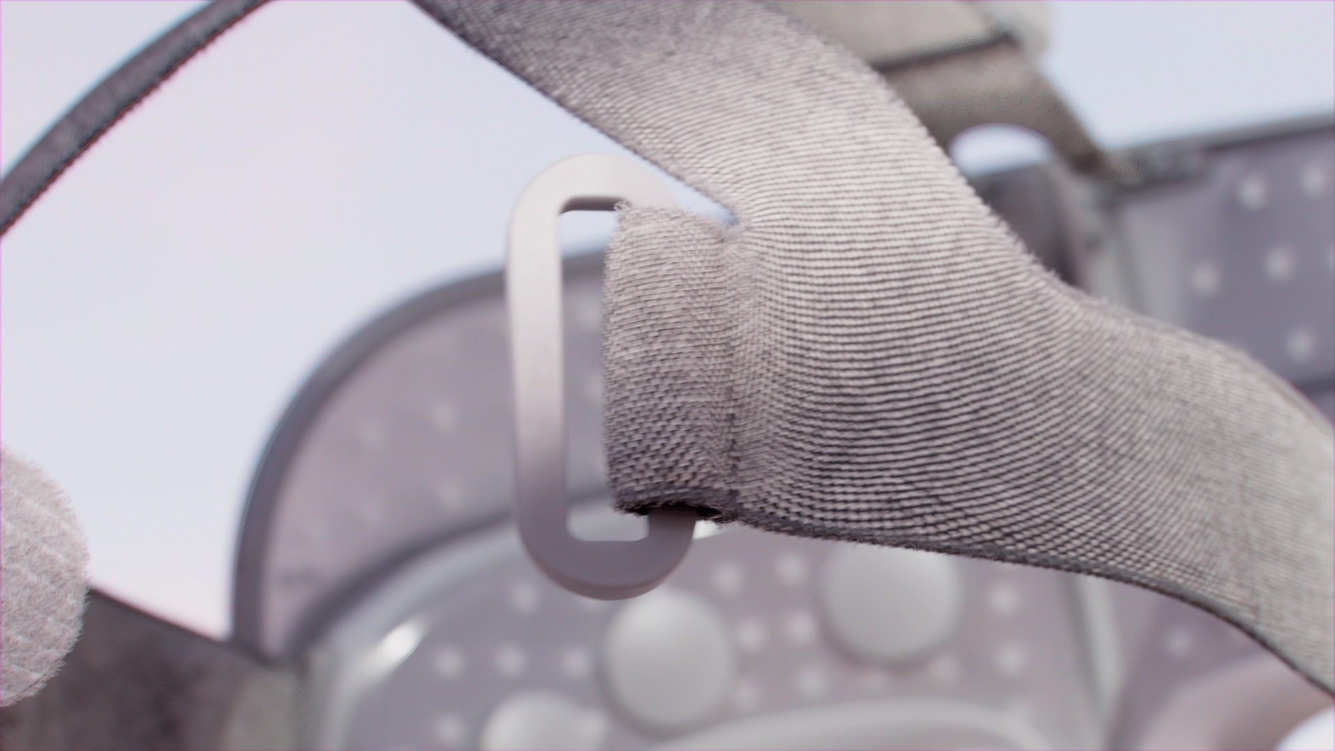 Animated sequence: A close-up of a gray fabric strap with a textured pattern.