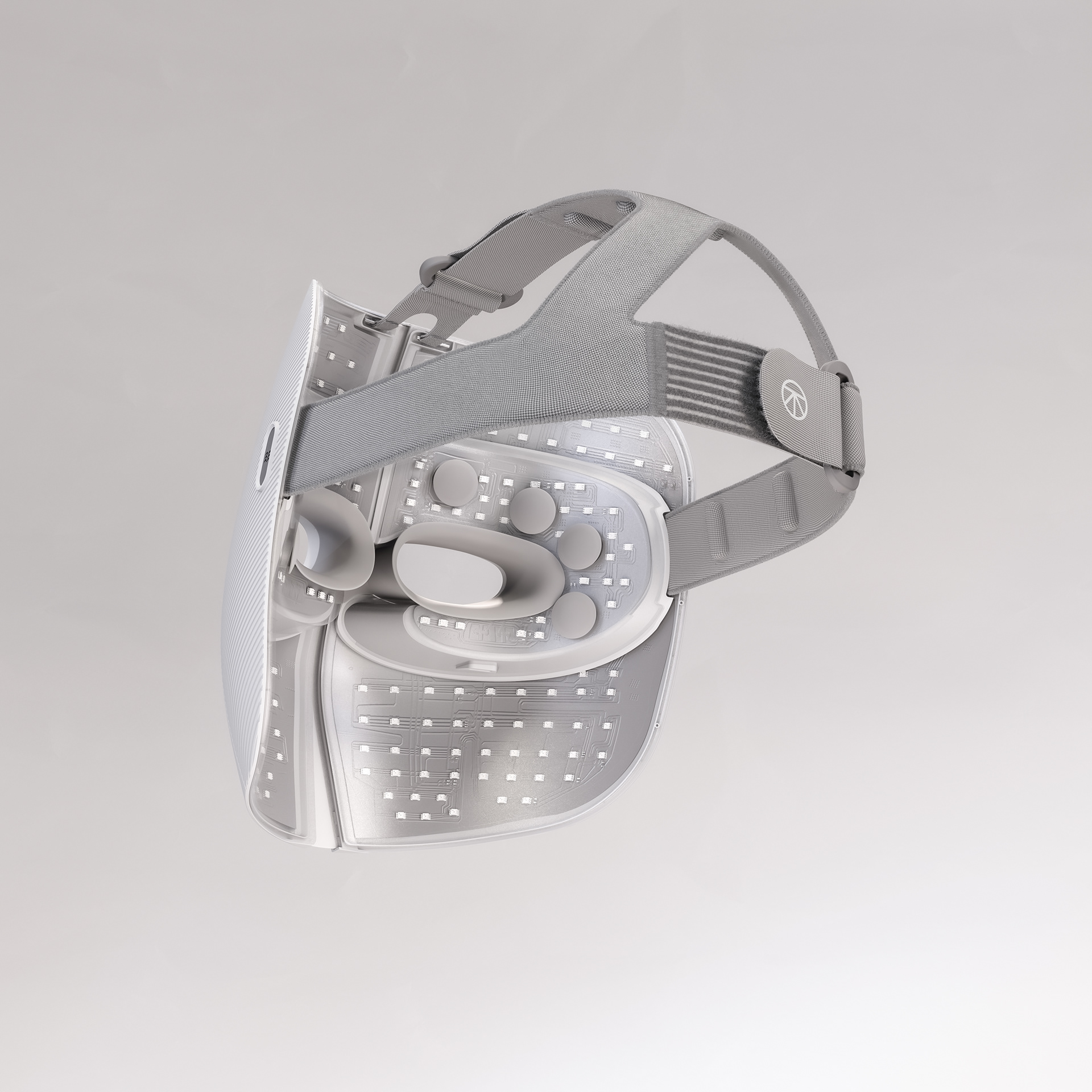 A futuristic mask with a sleek, white design featuring a headband and adjustable straps.