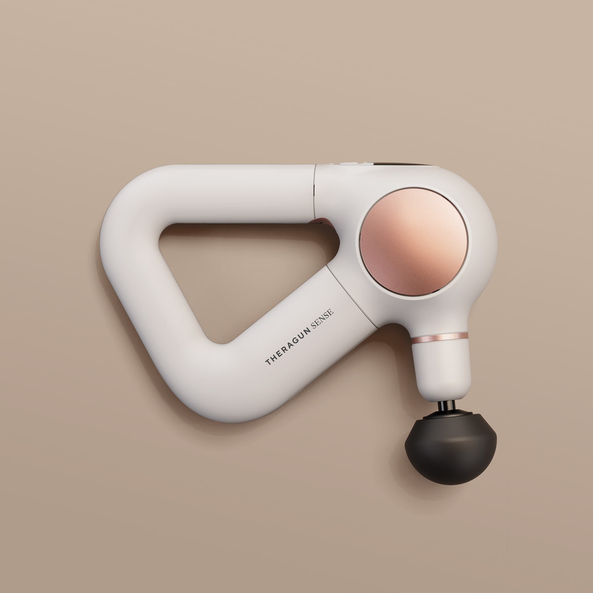 A sleek, white Theragun Pro Plus device with a rose gold circular button and black handle, set against a neutral background.