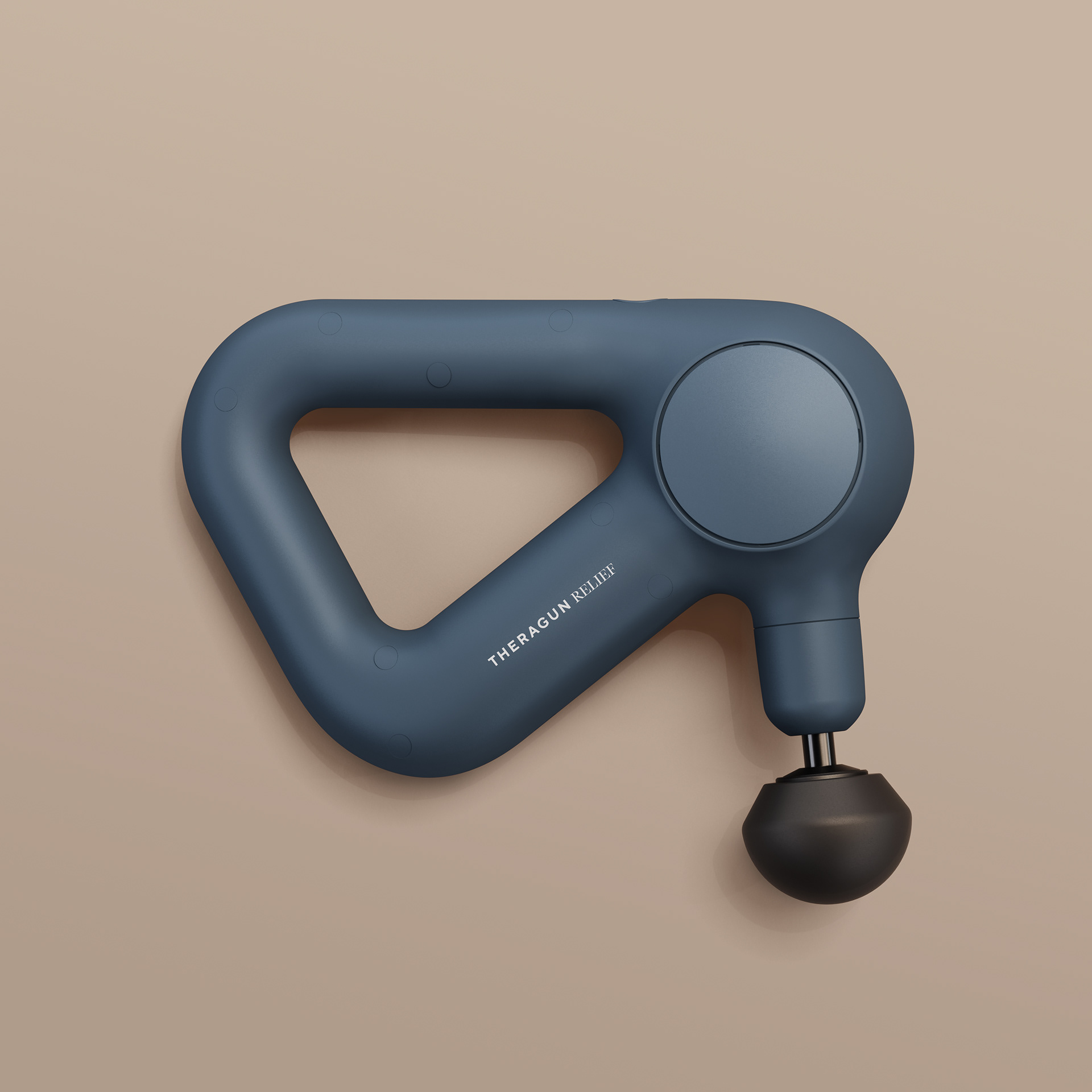 A dark blue handheld device with a circular button and a black handle, labeled "THERAGUN PRO PLUS" on its side.