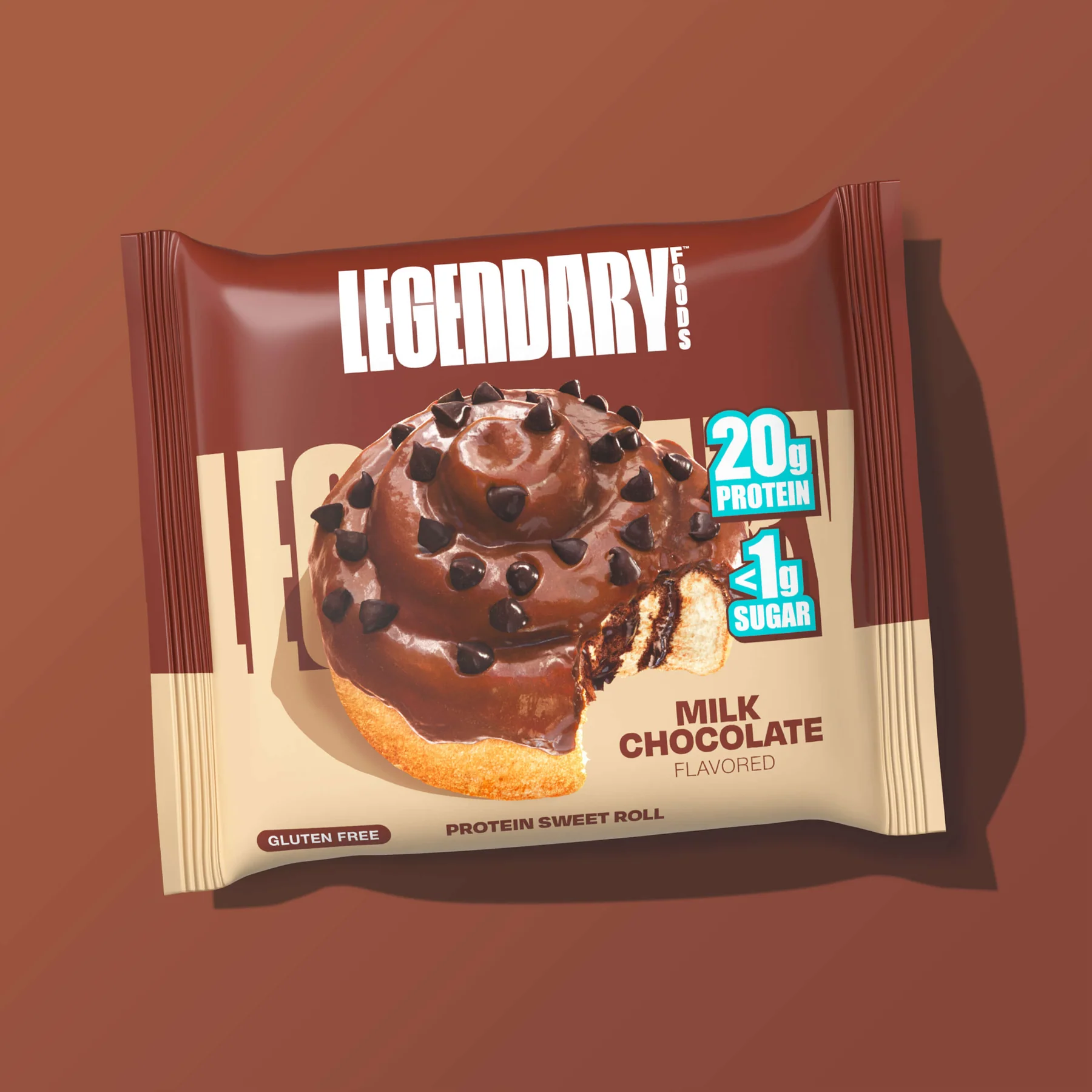 A milk chocolate protein sweet roll from Legendary Foods, gluten-free, with 20g protein and 1g sugar, displayed on a brown background.