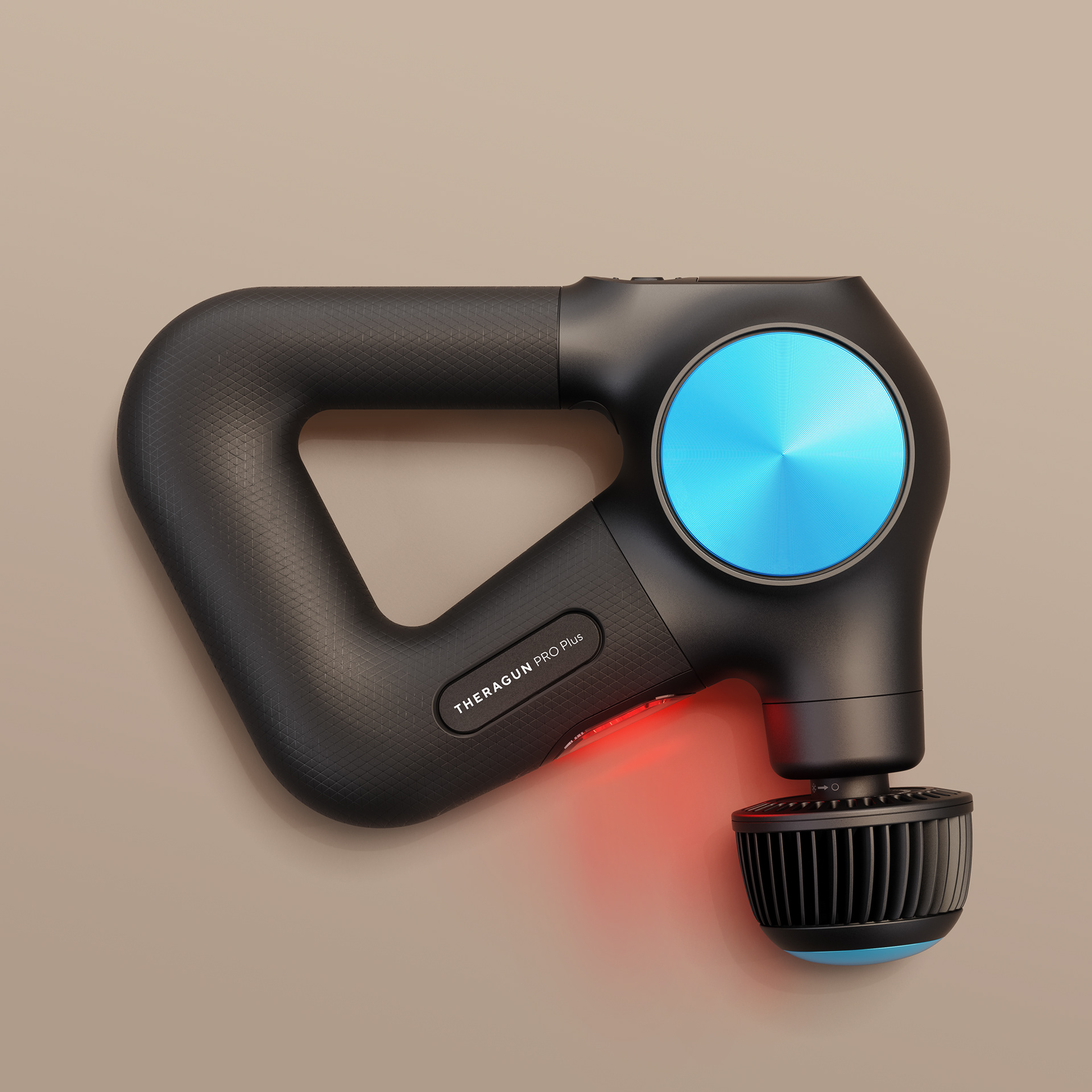 A black Theragun Pro Plus massage gun with a blue circular button and red light on a beige background.