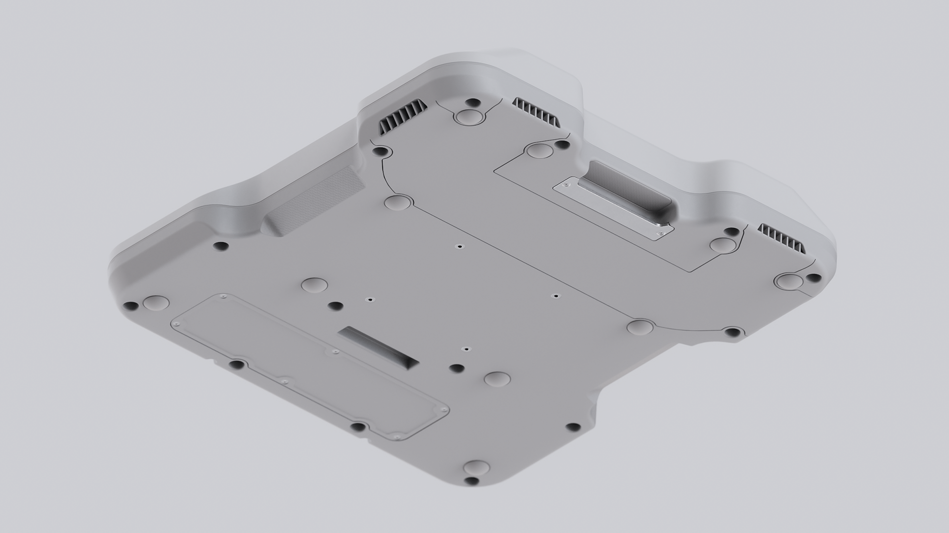 A white, rectangular device with multiple holes and protrusions.