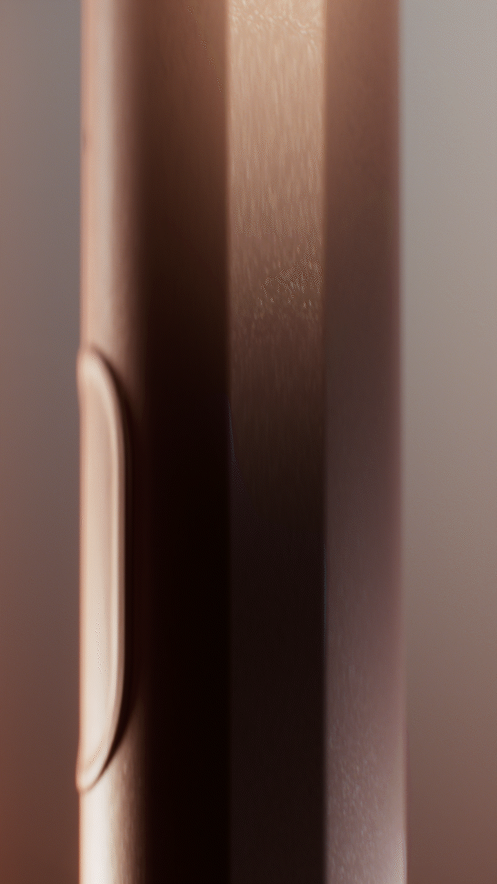Animated sequence: A sleek, metallic device with a circular button and a small, round indentation on its surface.