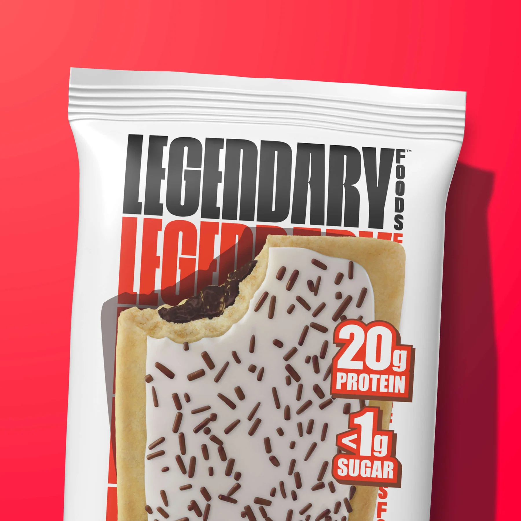 A protein bar package with Legendary Foods branding, showing a chocolate chip cookie with sprinkles, showing 20g Protein and <1g Sugar.