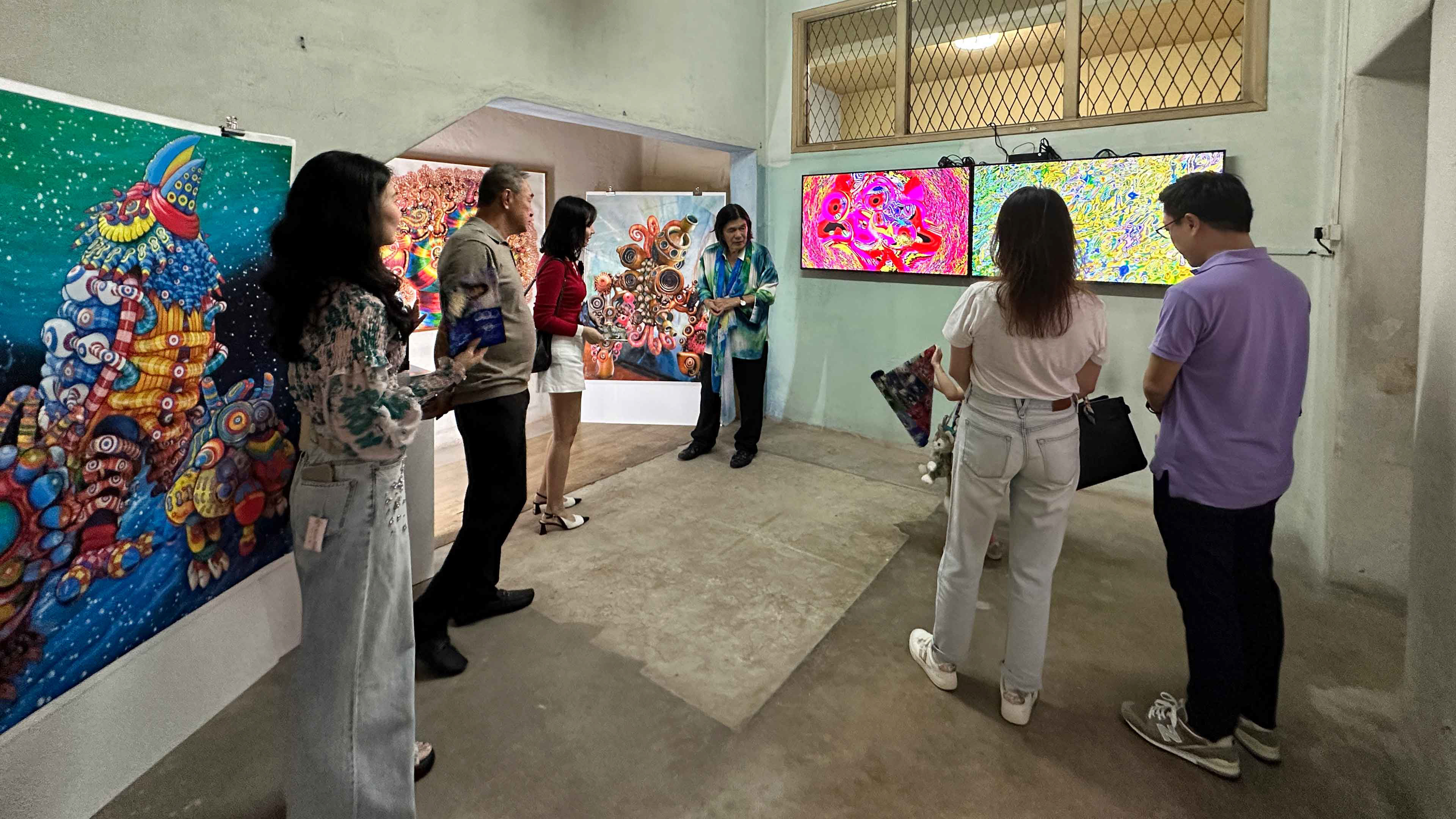 Artist Yoichiro Kawaguchi introducing his physical and digital works to guests