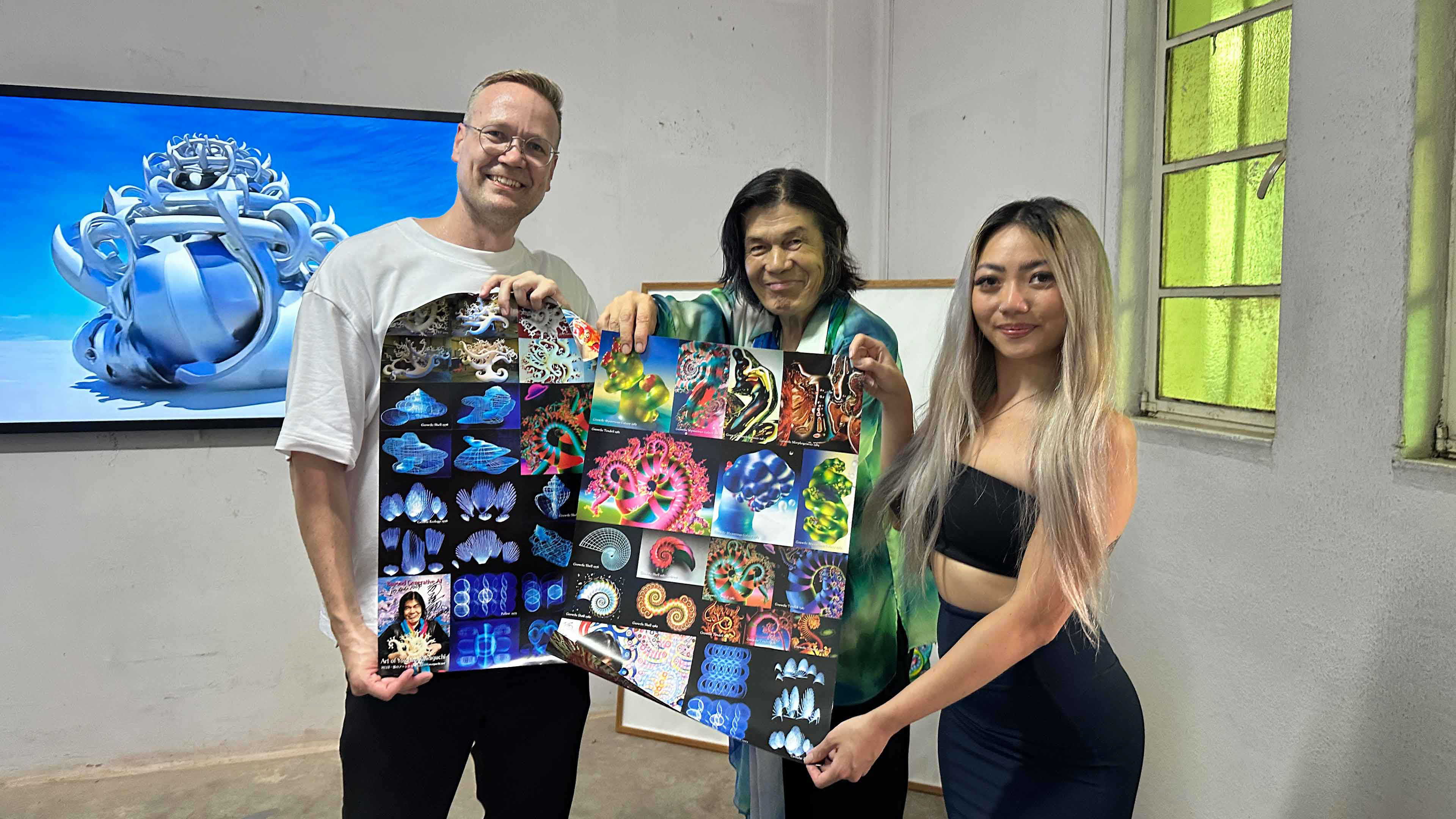 Artist Yoichiro Kawaguchi signs posters for guests