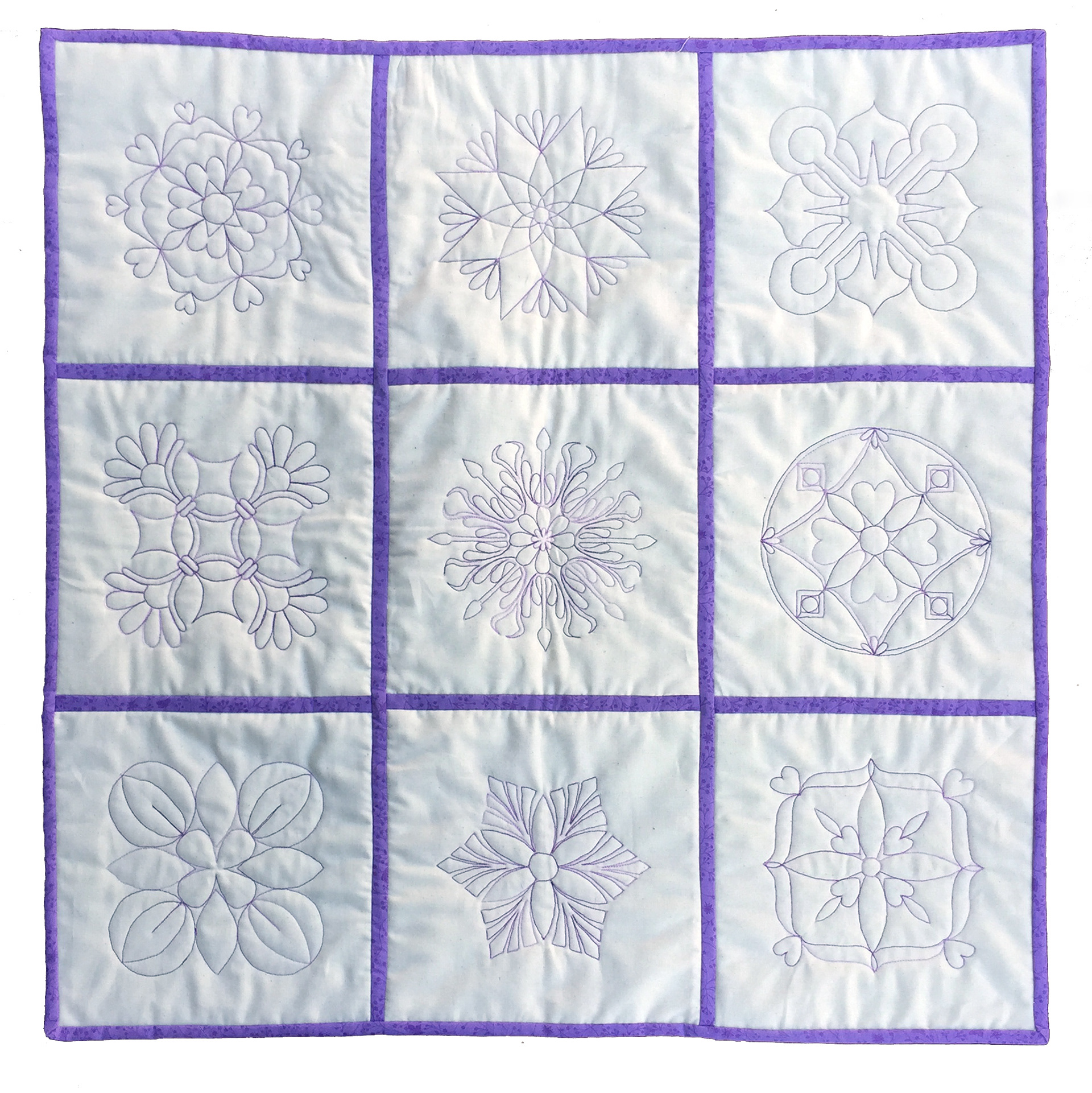 Self-designed free motion single line motifs (QAYG) - workshop sample