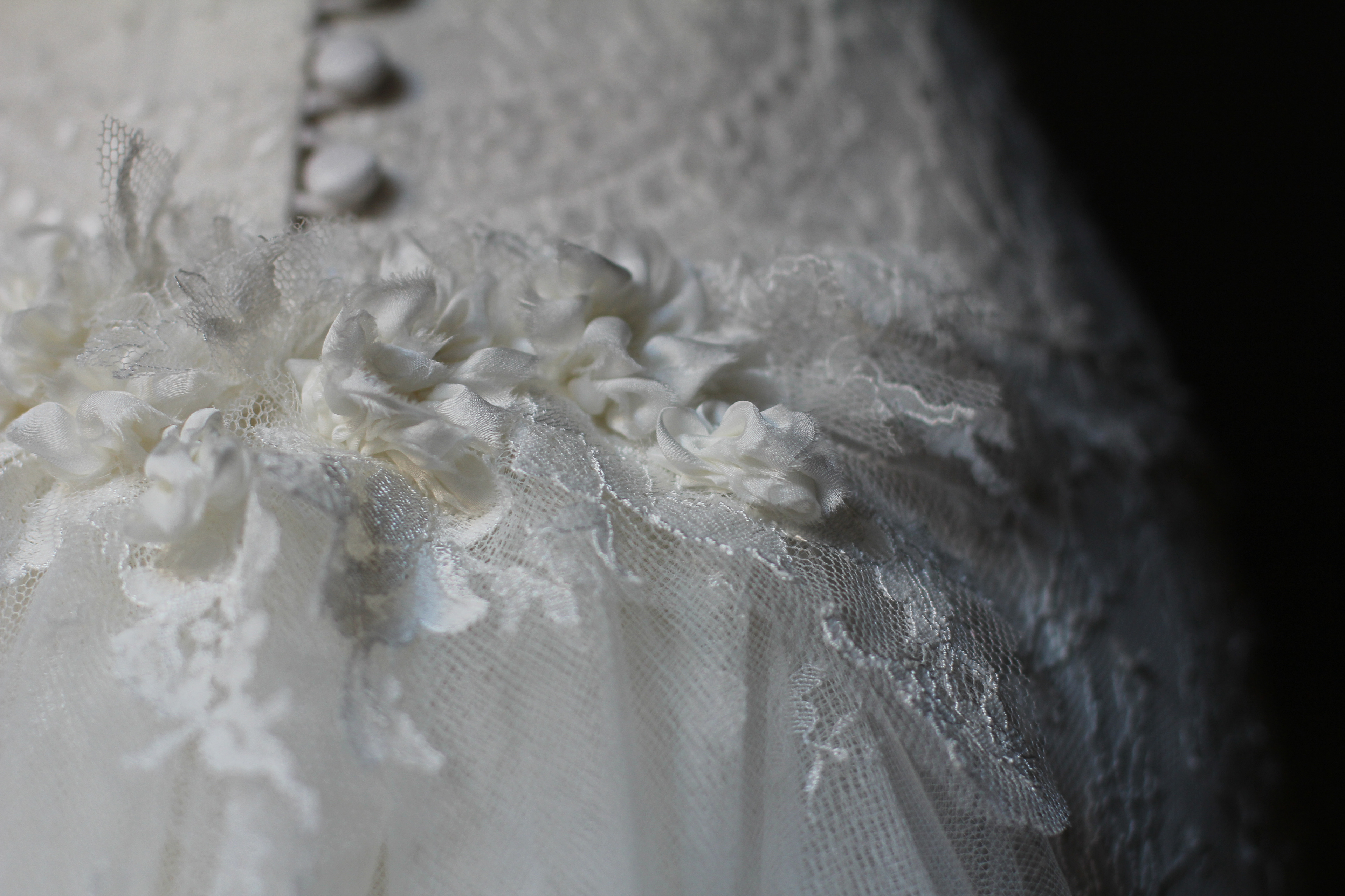 Close-up of the top of Meghan's lace and tulle train. Photo credit: Colette Komm