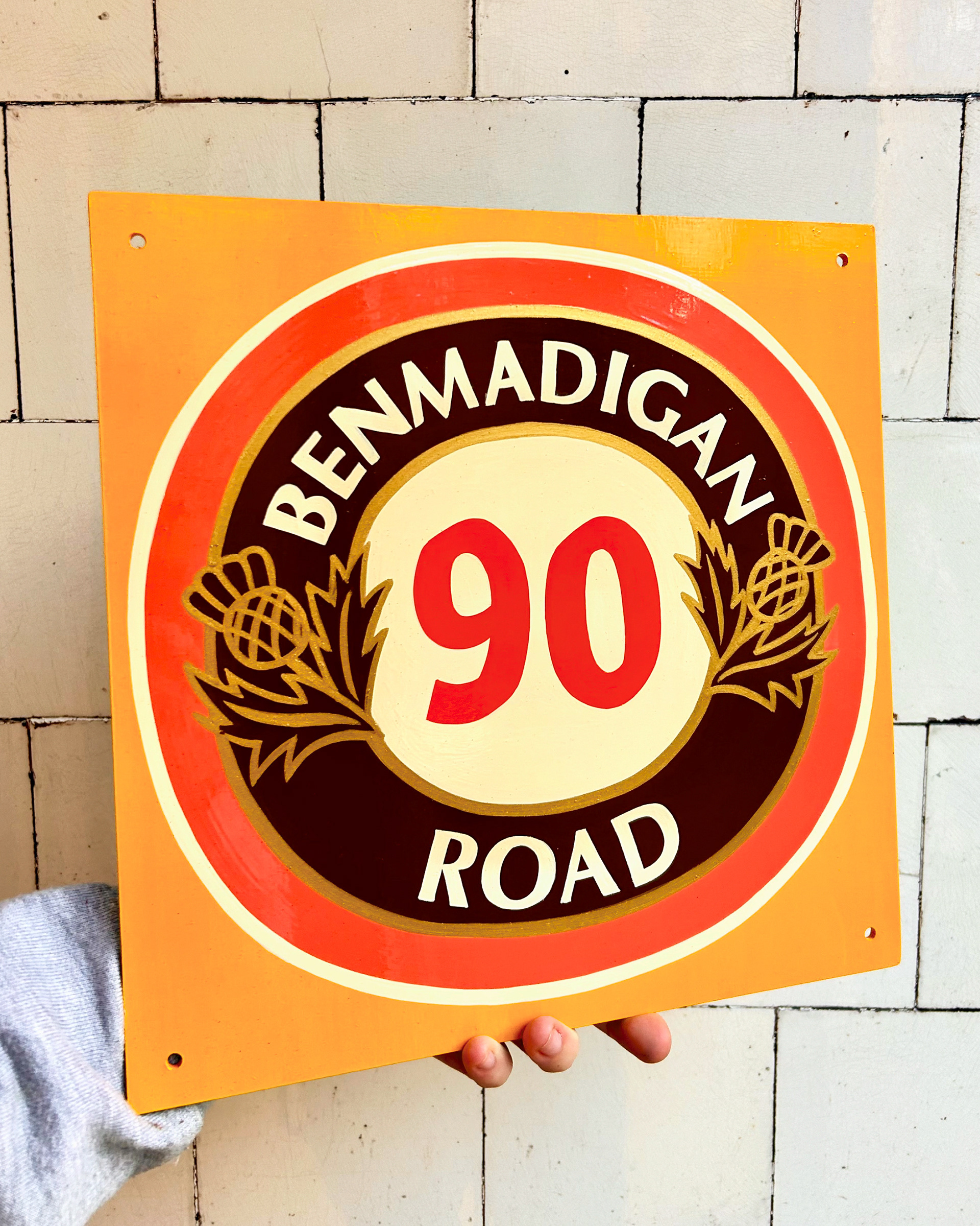 House number using enamel paint, designed based off of an old Tennents beer matt.