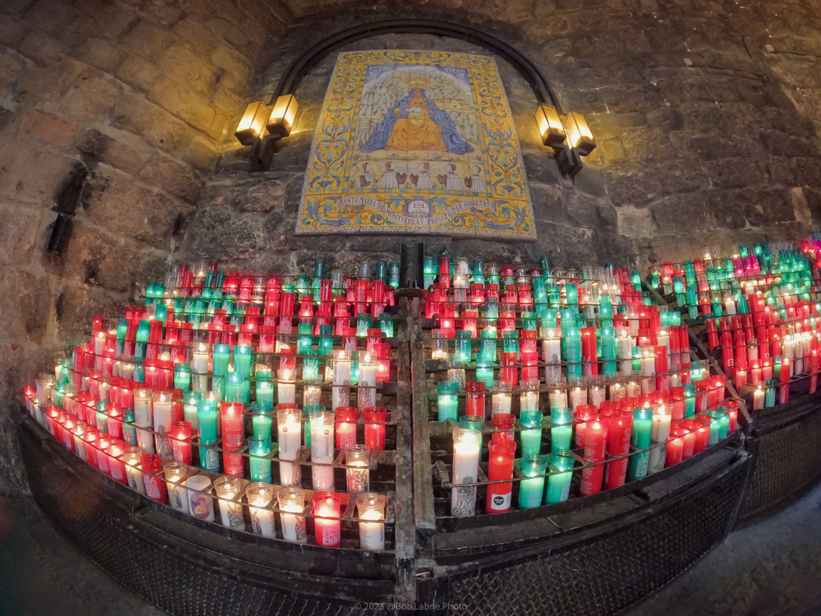 Votive candles to an icon of Santa Maria de Montserrat Abbey - Montserrat, Catalonia, Spain