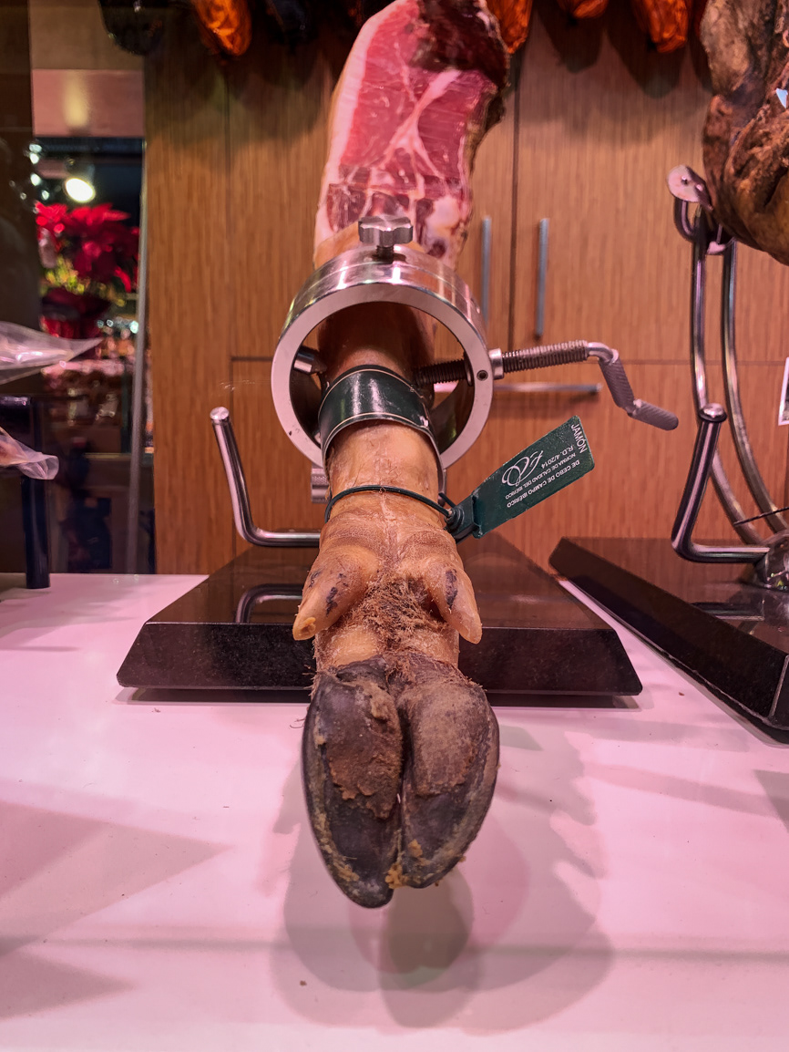 Jamón ibérico, or Iberian ham, is a type of cured leg of pork - La Boqueria Market - Barcelona, Spain