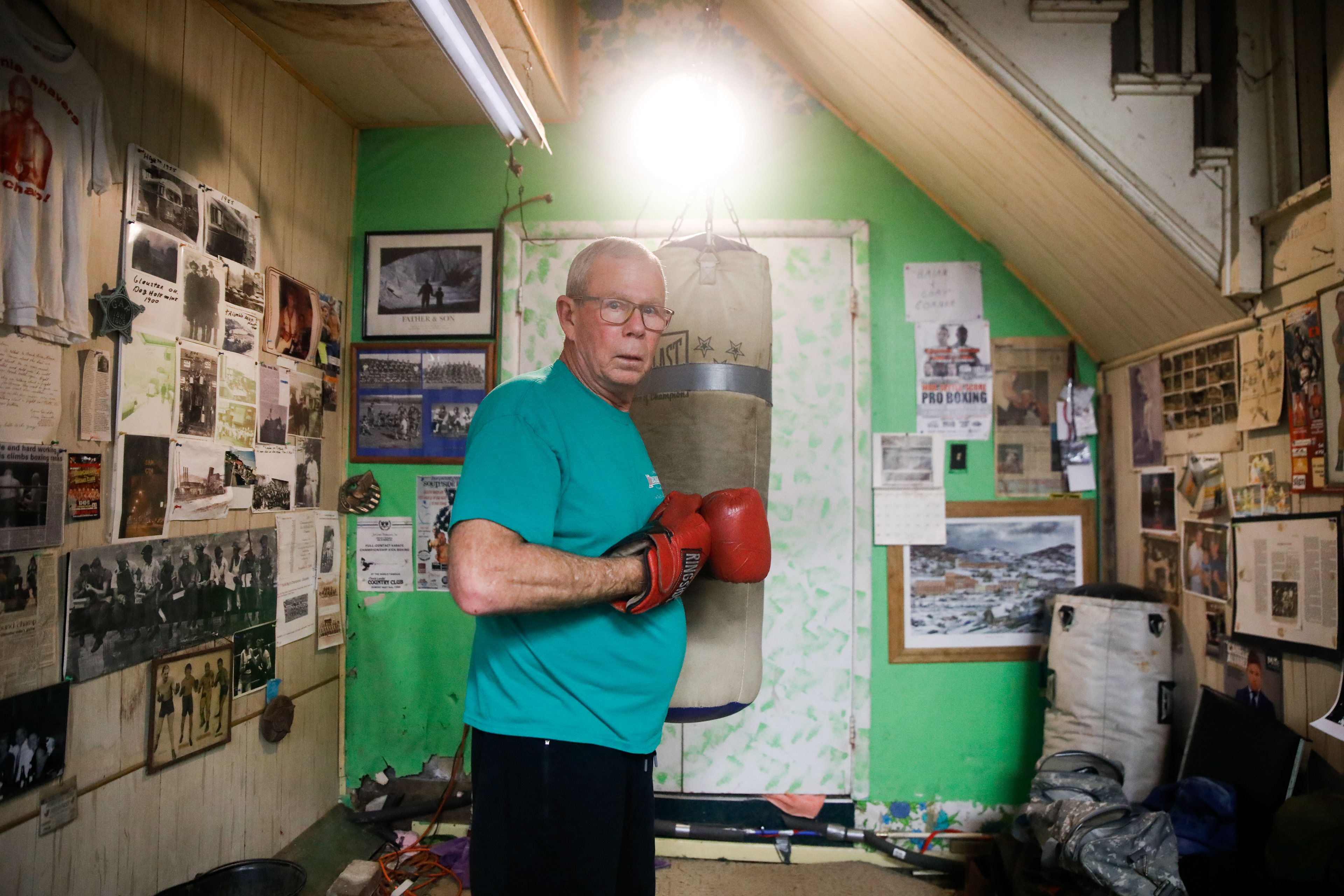 Darrell Dugan pauses while practicing jabs on a punching bag at Sam's Gym in Glouster, Ohio, Jan. 7, 2024. Dugan has been attending the gym for over 60 years, both coaching and practicing himself. He was one of Sam's first students whom he taught when he was 11.