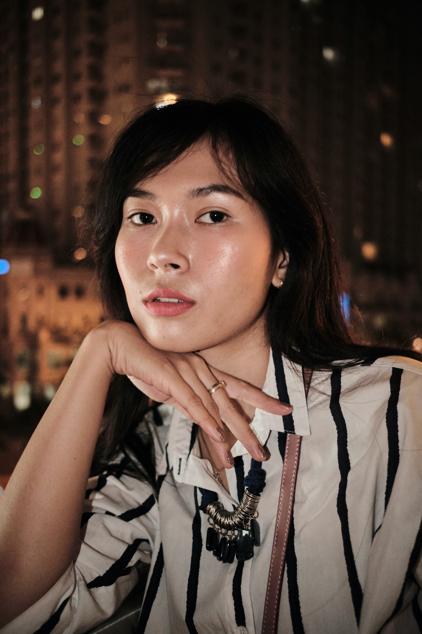 woman wearing white and black striped collared top