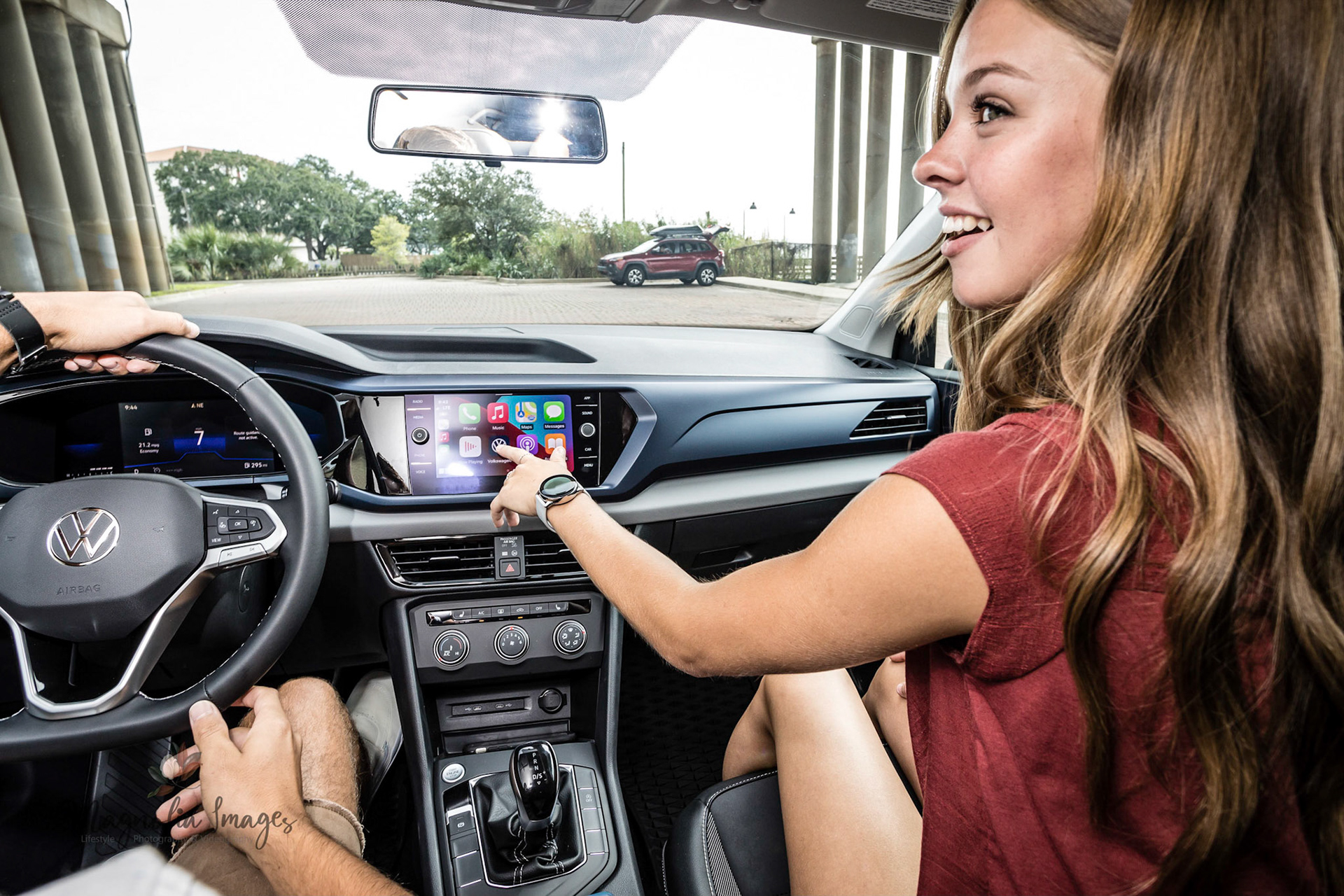Hailey checking out the features of the infotainment system in the VW Taos
