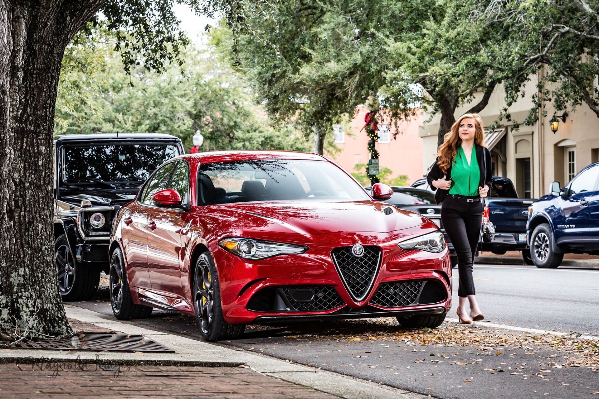 Tori with her Alfa Romeo Giulia Quadrifoglio in downtown Pensacola
