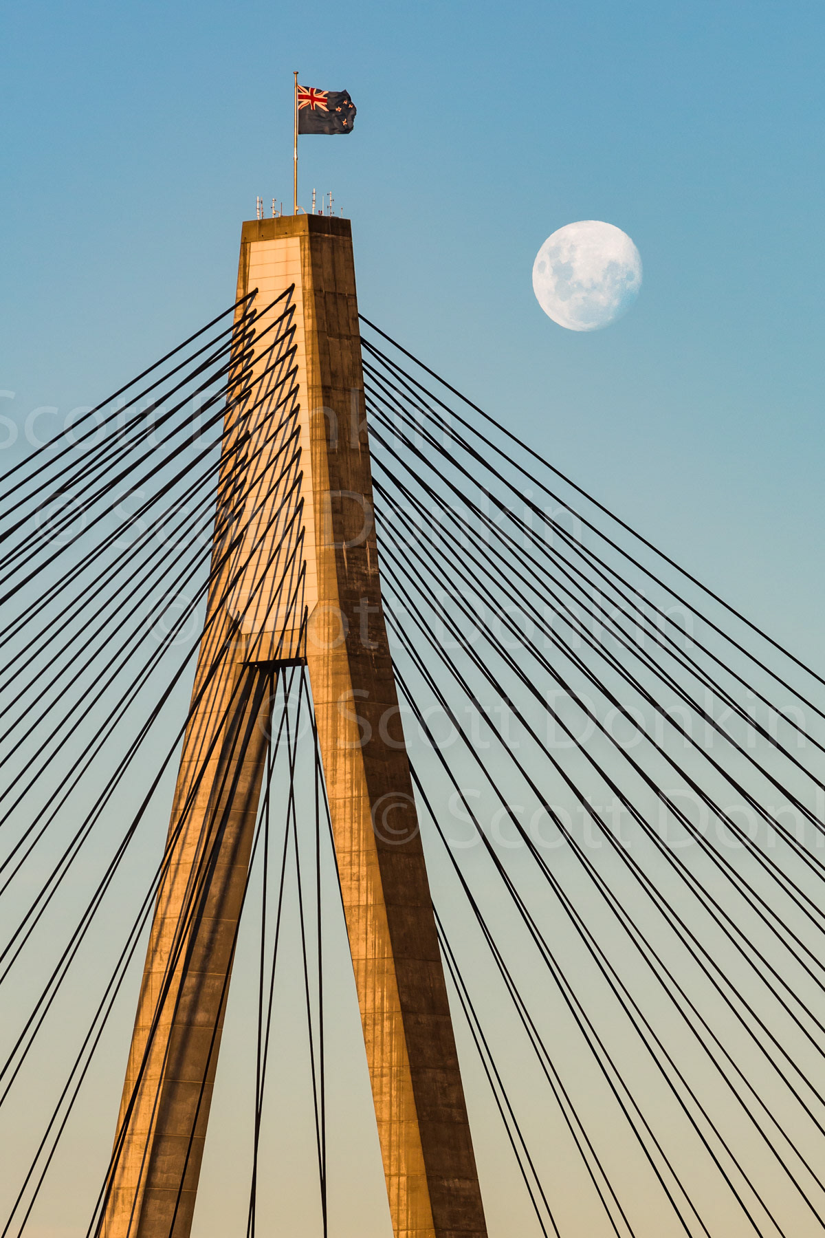 SYDNEY, NSW, AUSTRALIA - 28 February 2018:  Moonrise over the ANZAC Bridge at 7:06pm.  Waxing moon, 96% disc illumination. Single exposure.