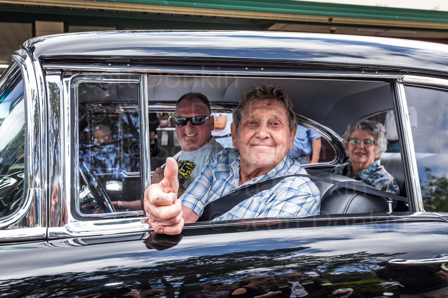 BROOKLYN, NSW, AUSTRALIA - 4 December 2018: Jack Taylor is an avid motorcycle enthusiast.  Owner of eleven classic motorcycles, “old Jack", as he likes to call himself, rides "pretty much every day”.  Today, during celebrations of his 93rd birthday, Jack and wife June take the passenger seats for a ride in a 1957 Chevrolet Belair with friend, Lee Platt.  Jack started riding in 1947 after paying twenty five pounds for his first bike, a 1925 Harley Davidson. 