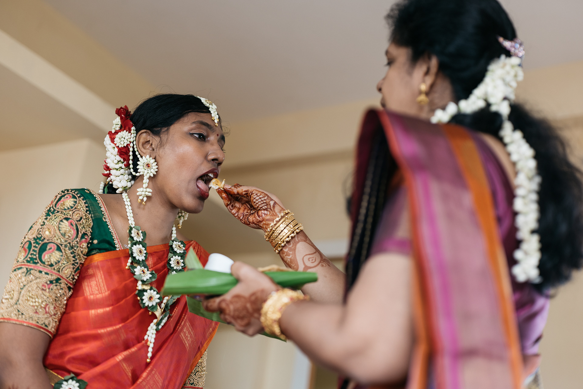 Aunt feeding the bride