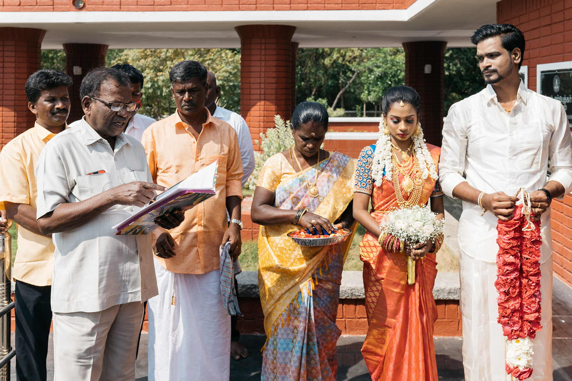 He reads out the wedding vows