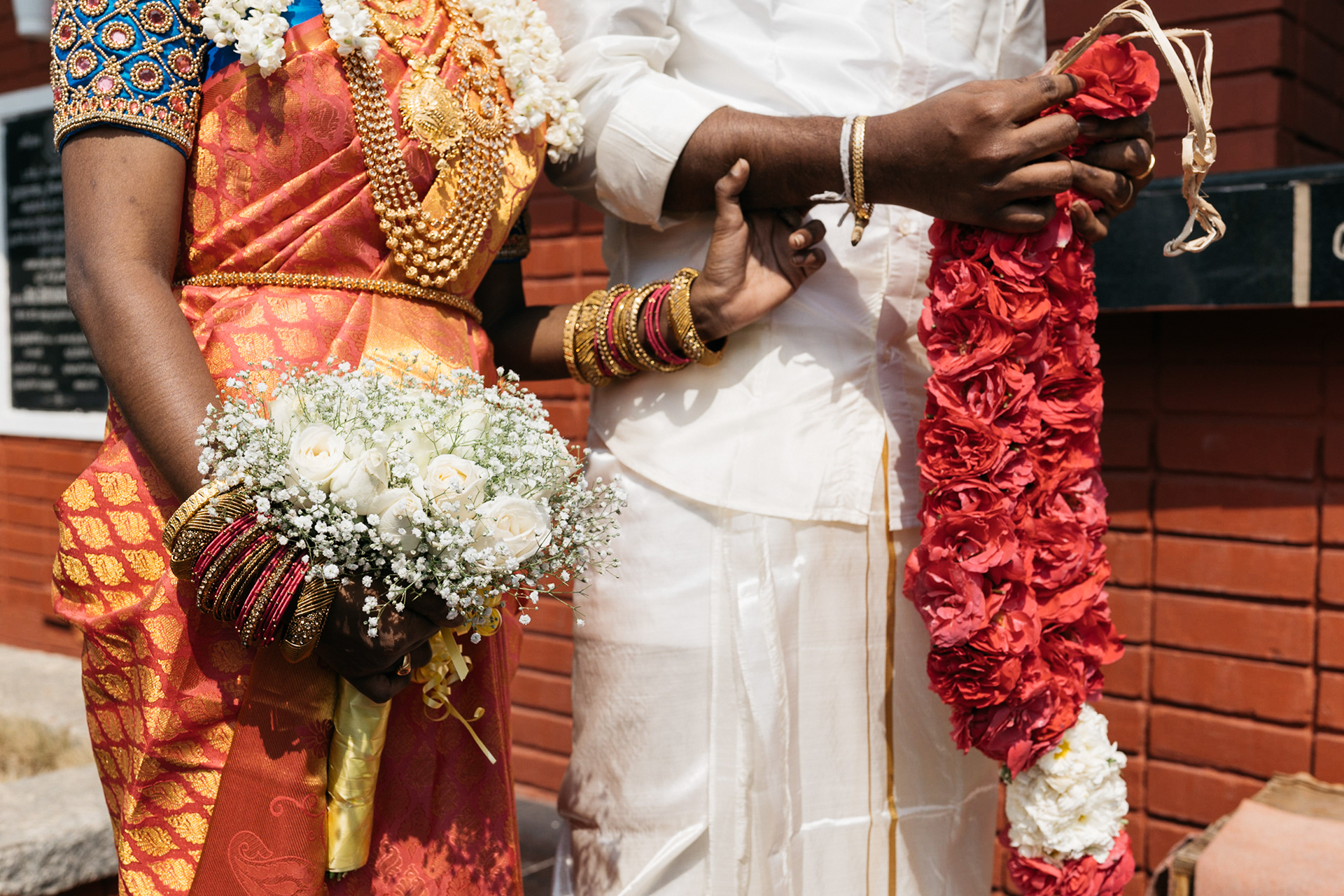 Bride with bokeh and groom with garland