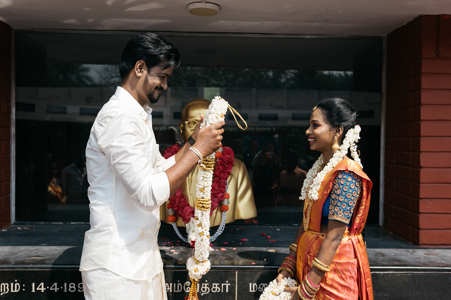 Bride happily accepts the garland