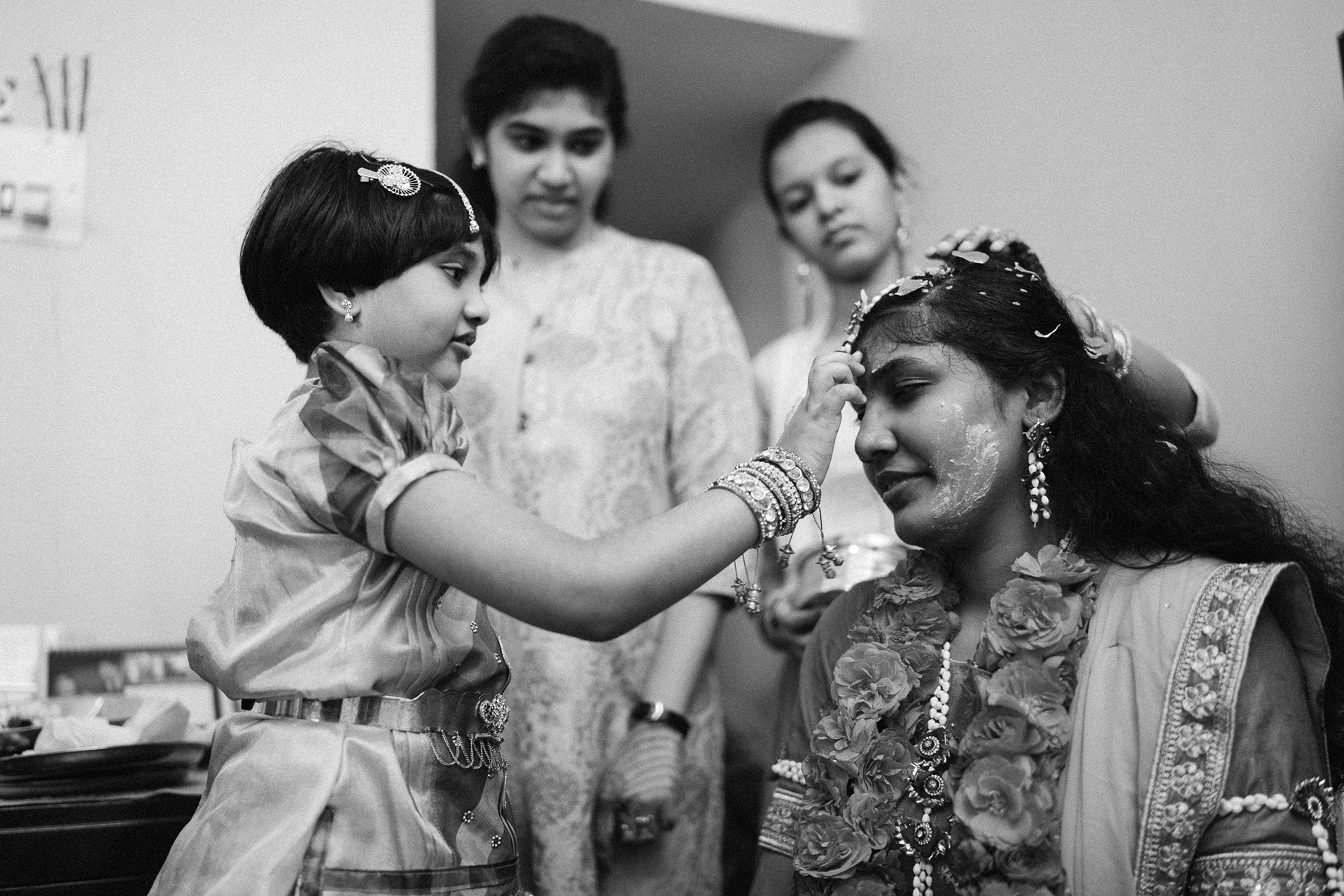 Its a sight to see this child put that pottu