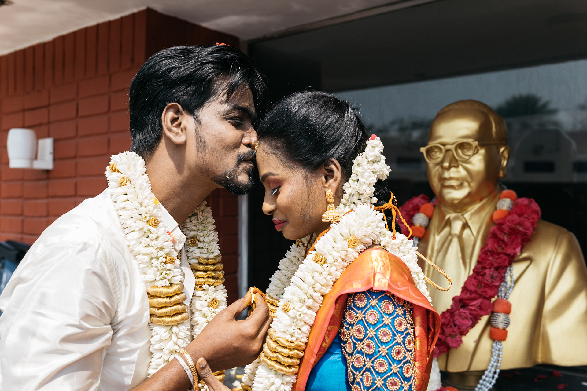 Groom kisses the bride after wedding