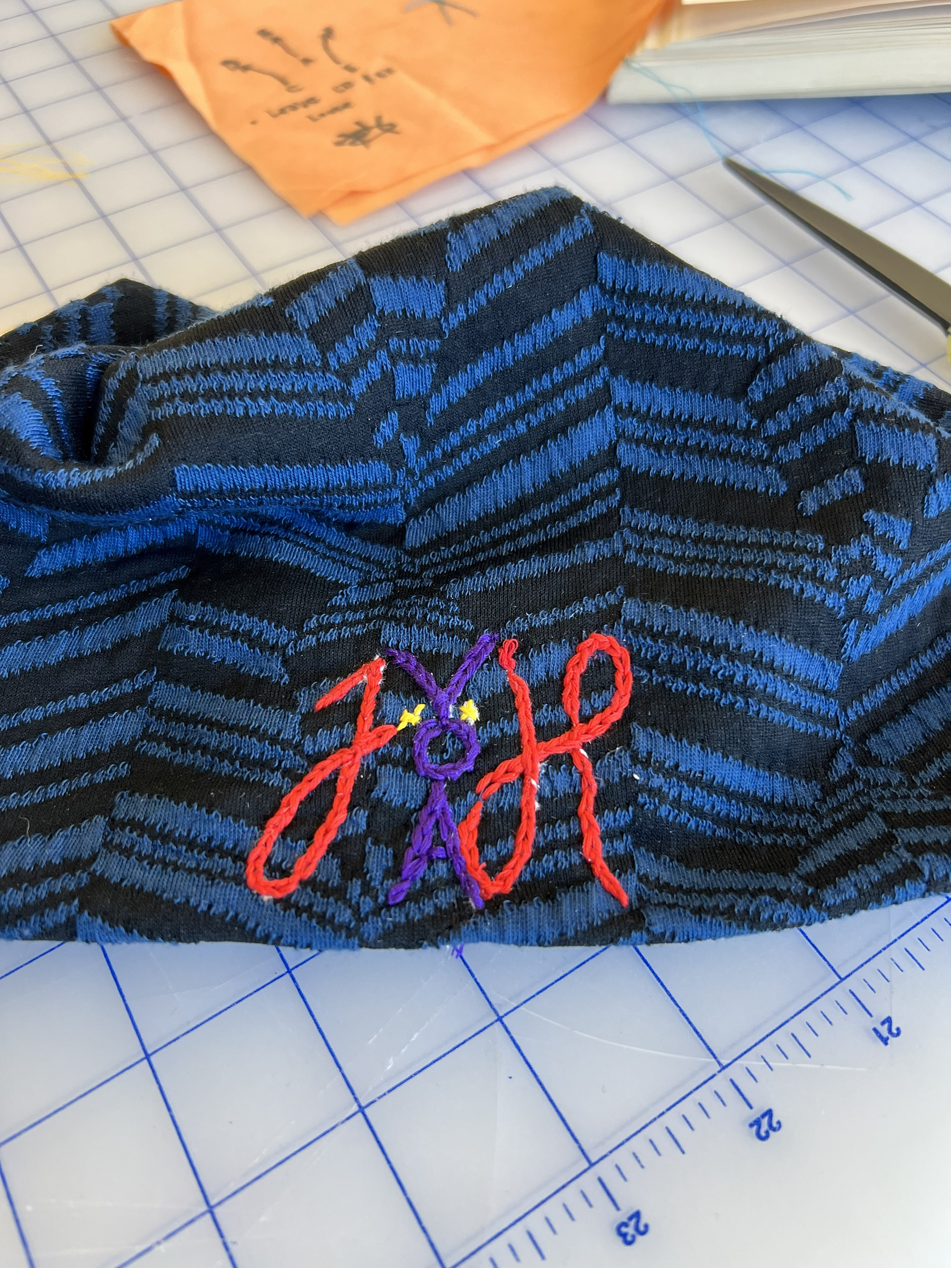 Blue/Blakc stretch knit beanie with JNOVAH  hand chain stitch embroidery 