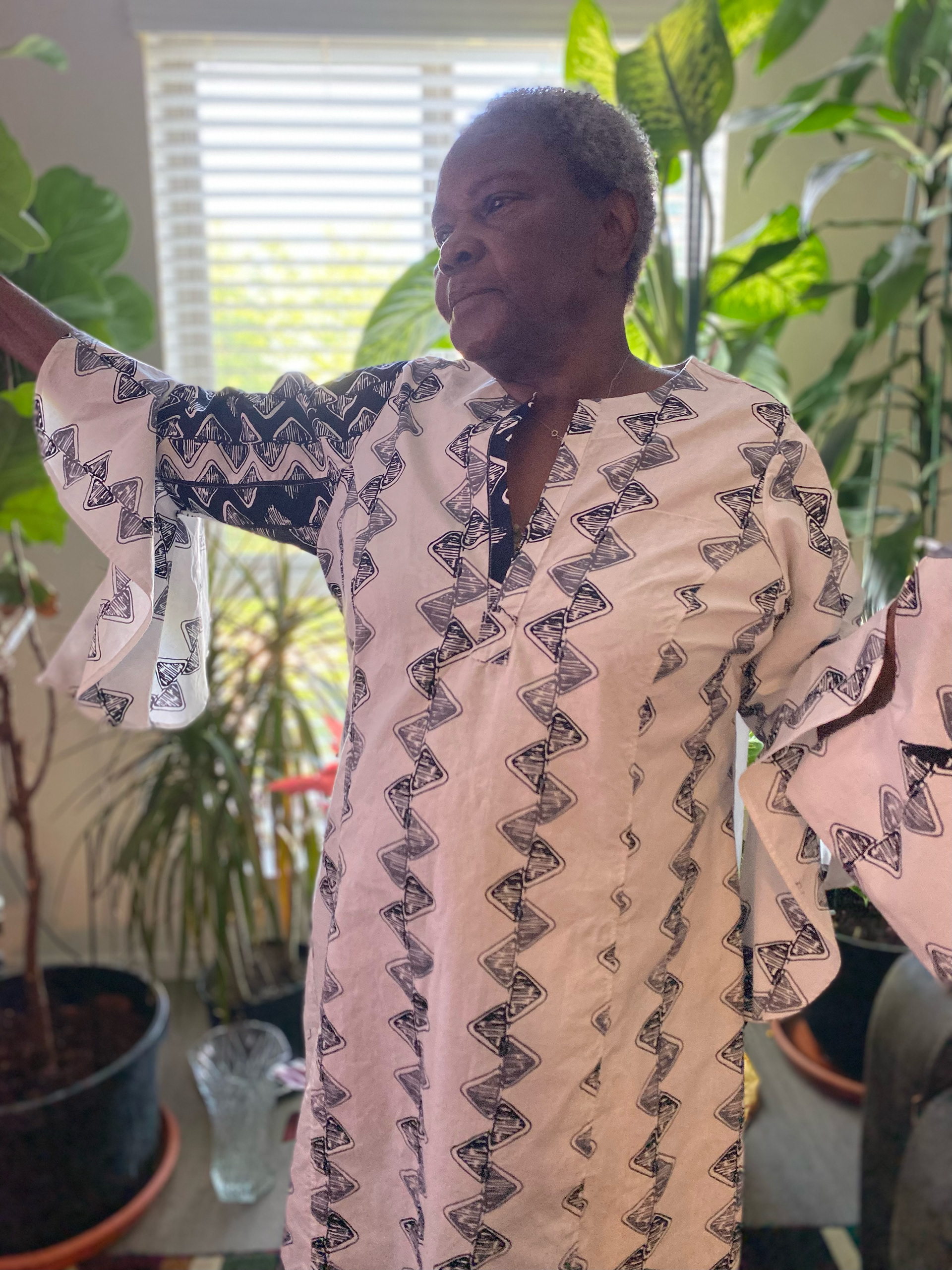 African textile dress with bell sleeve and princess lines.