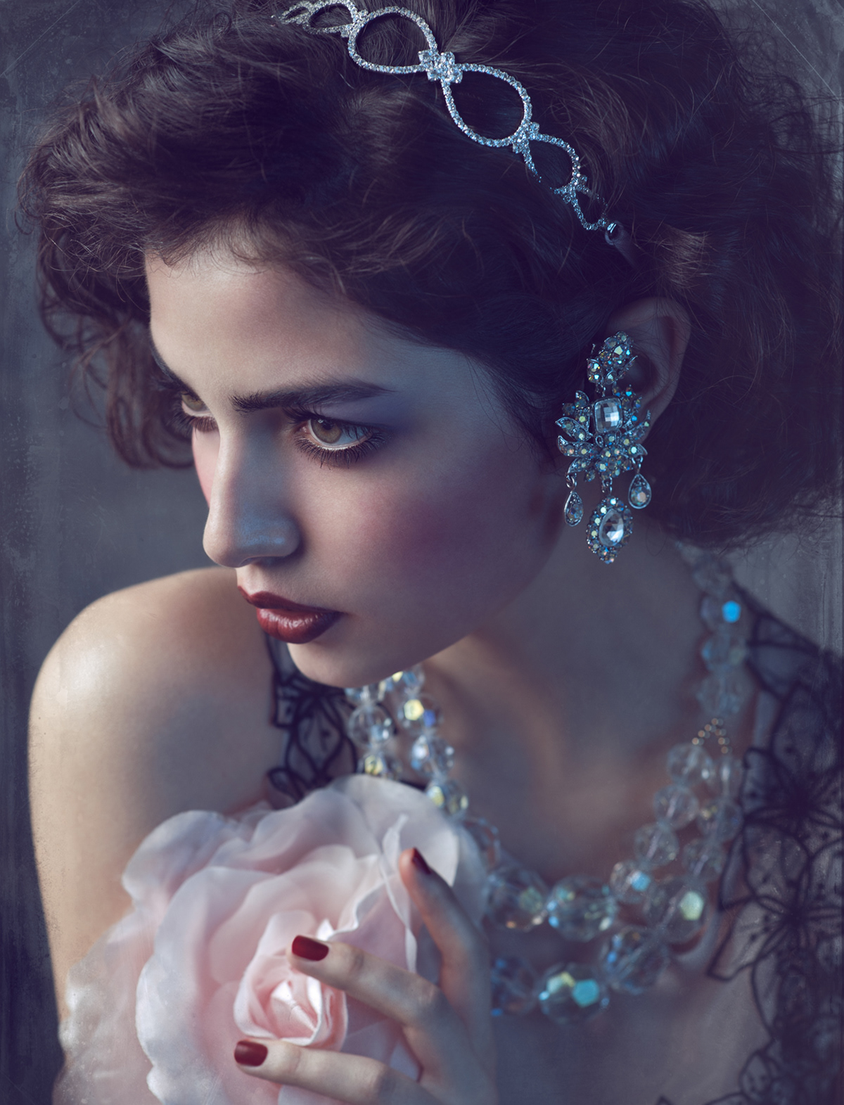 Moody fine art portrait of woman with large jeweled necklace and floral accessory – Joanna Kustra vintage-inspired photography