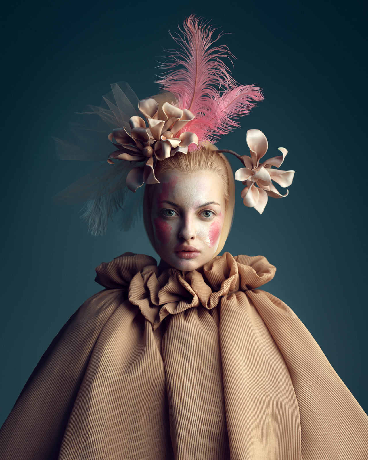 High-fashion editorial beauty portrait with avant-garde beige gown and feather headpiece – Joanna Kustra photography