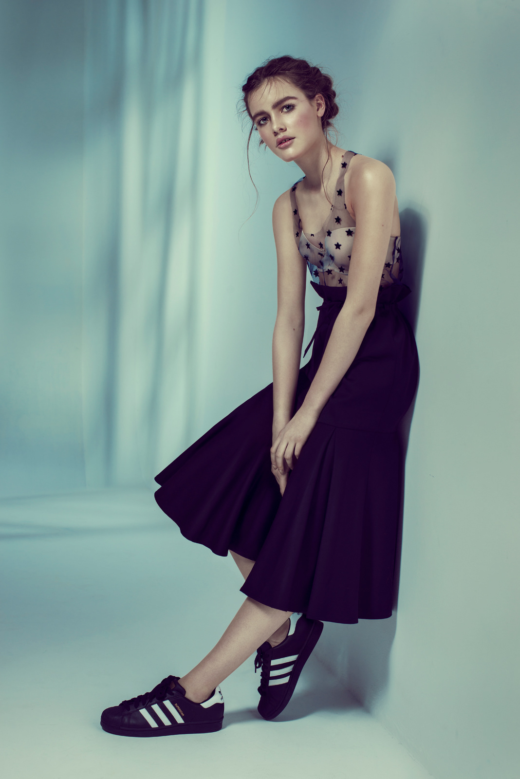 Studio fashion portrait with model in black midi skirt and polka dot bodice – Joanna Kustra modern editorial photography