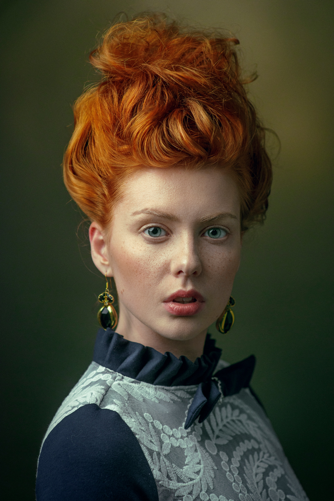 Editorial portrait of red-haired model in blue patterned dress with high collar – Joanna Kustra fine art fashion photography