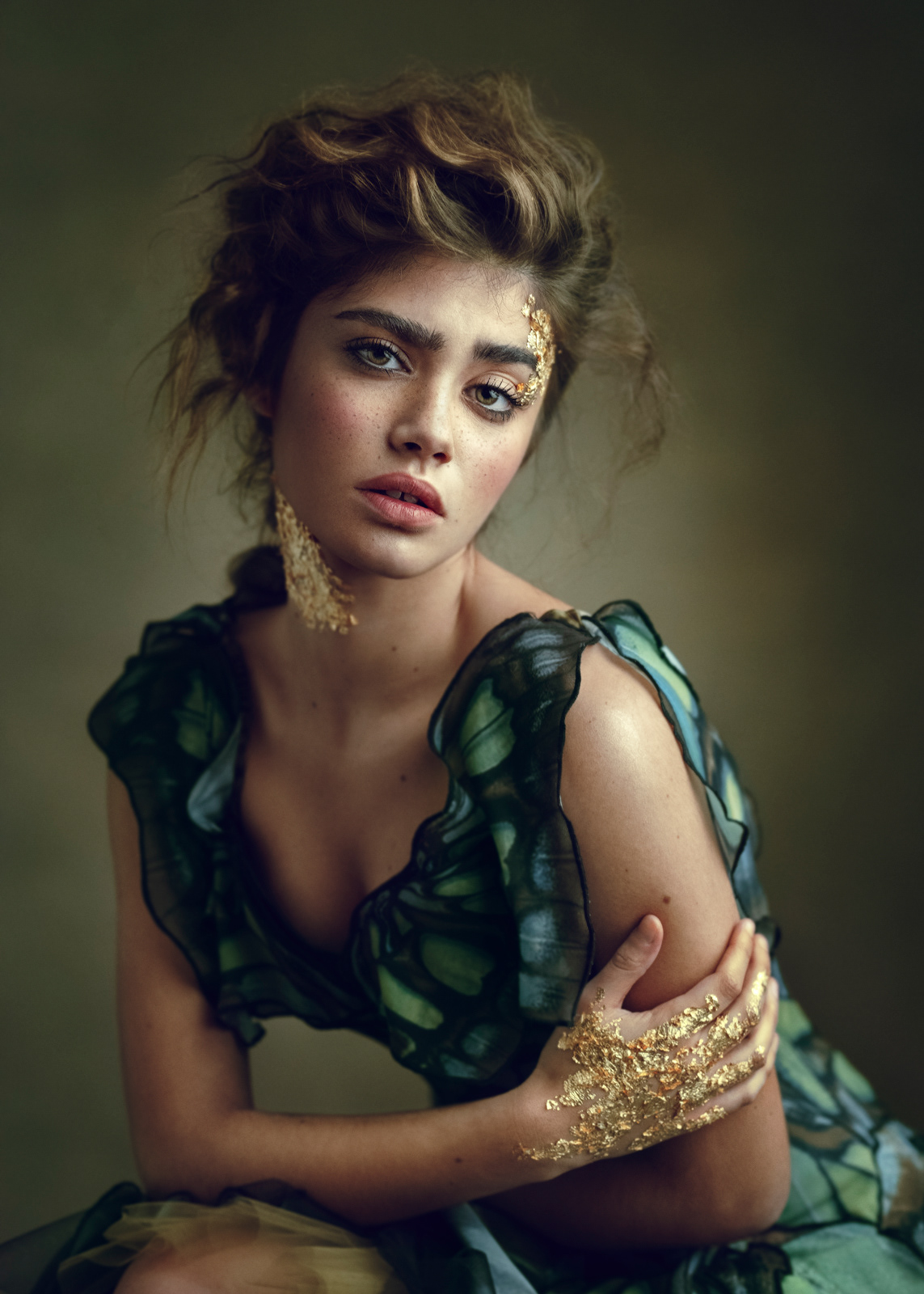 Editorial fashion portrait of model in green gown with gold leaf makeup – Joanna Kustra couture fashion photography