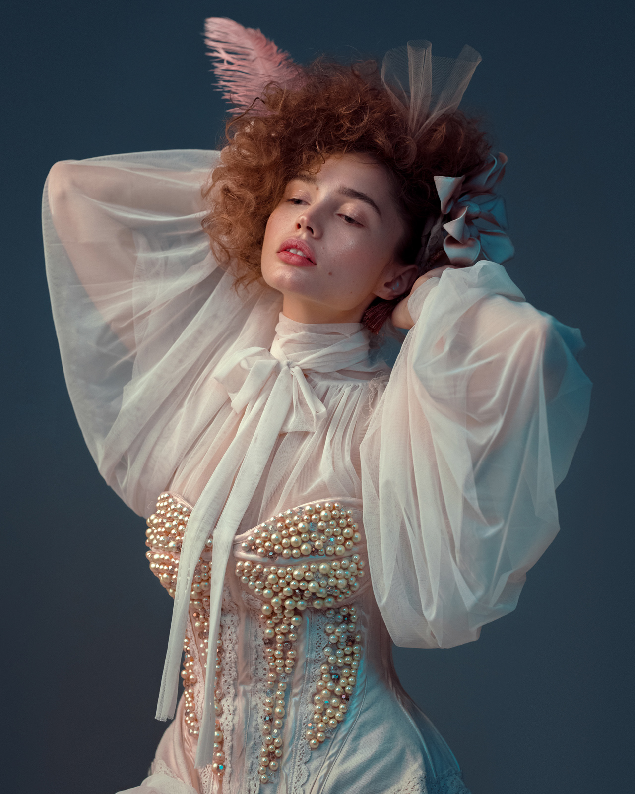 High-fashion editorial portrait with pearl-embellished sheer gown and feather headpiece – Joanna Kustra creative fashion photography