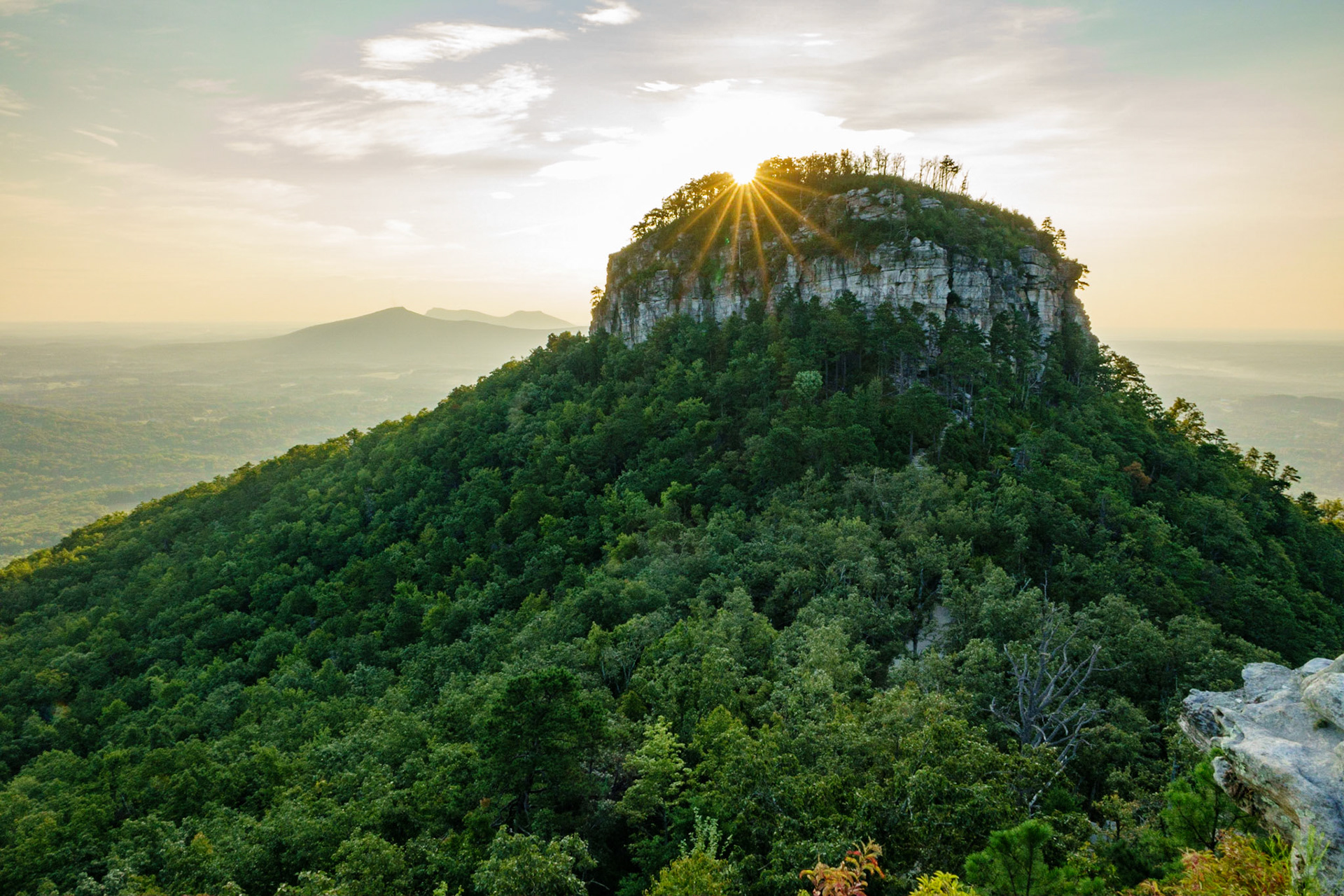 Sun Cresting Pilot Mountain