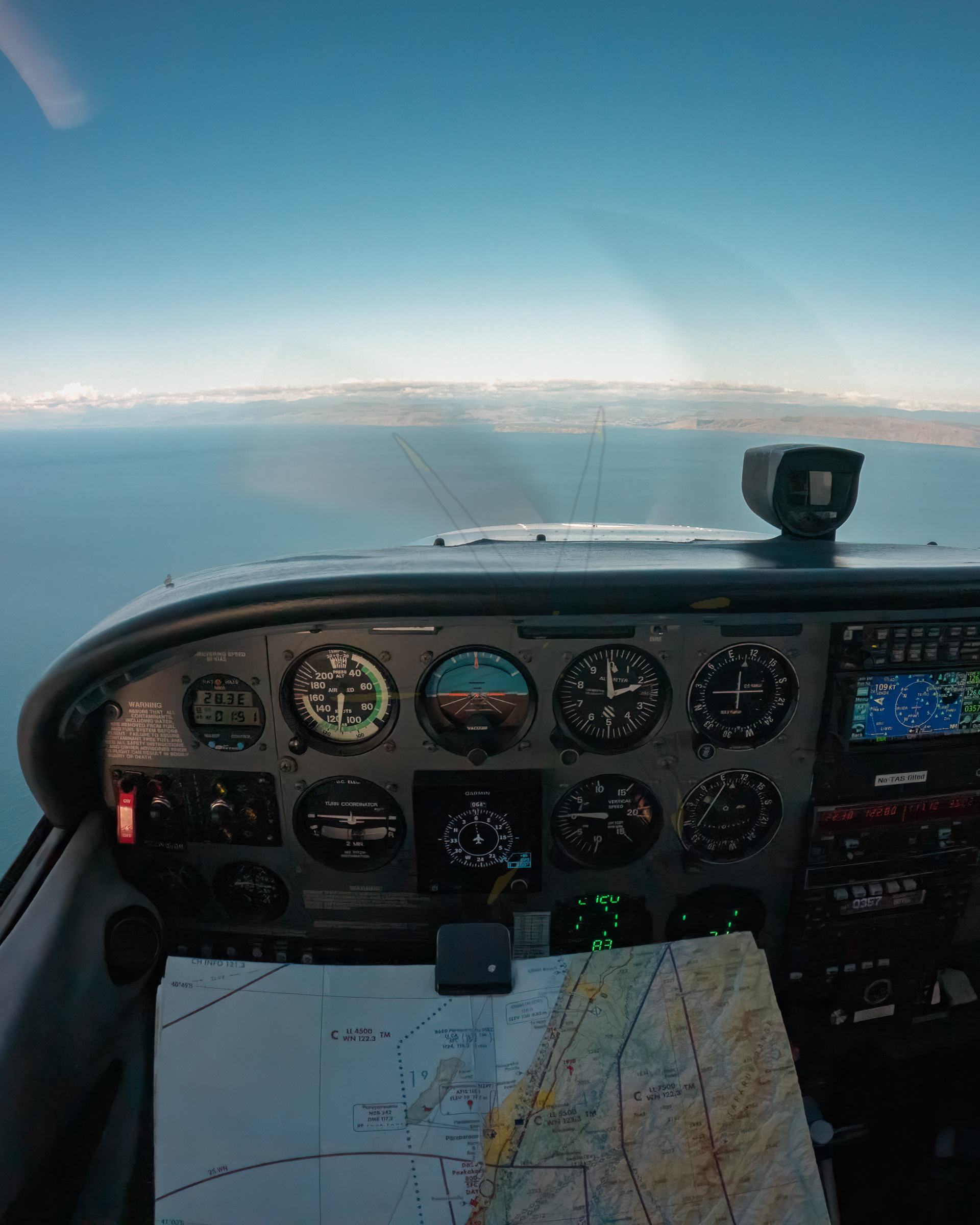 Crossing the Cook Strait on my way back from Omaka (NZOM). Ahead, on the horizon, is Mana Island, and the city of Wellington. 2.71mm, 1/240s, F2.5, ISO 559