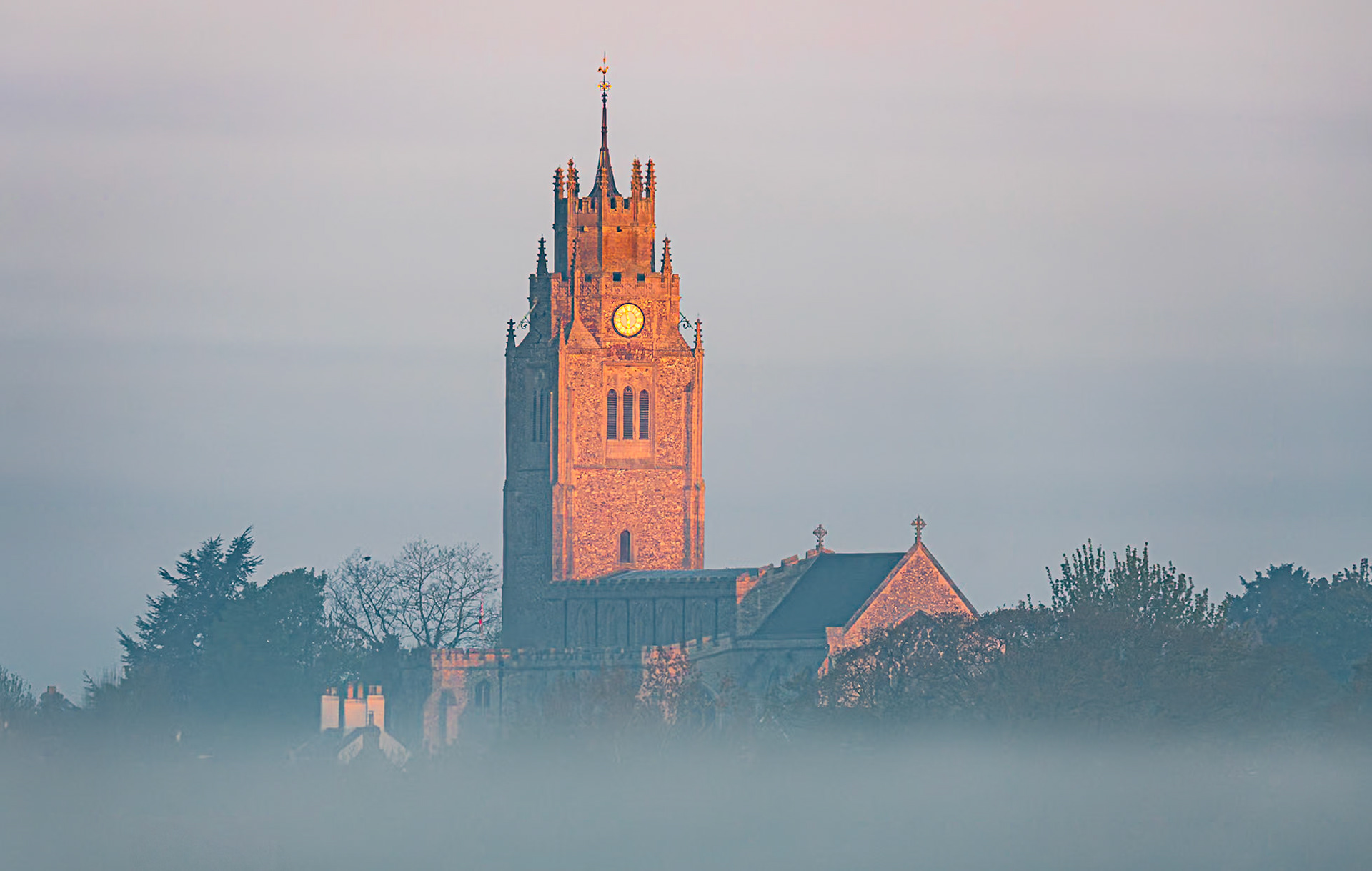 St Andrew's Church, Sutton-in-the-Isle, emerges from the morning mist, 2nd May 2021