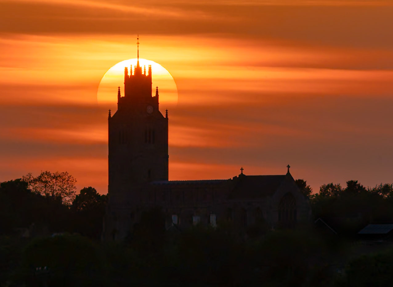 Sunset behind St Andrew's church, Sutton-in-the-Isle, Cambridgeshire, 8th May 2022