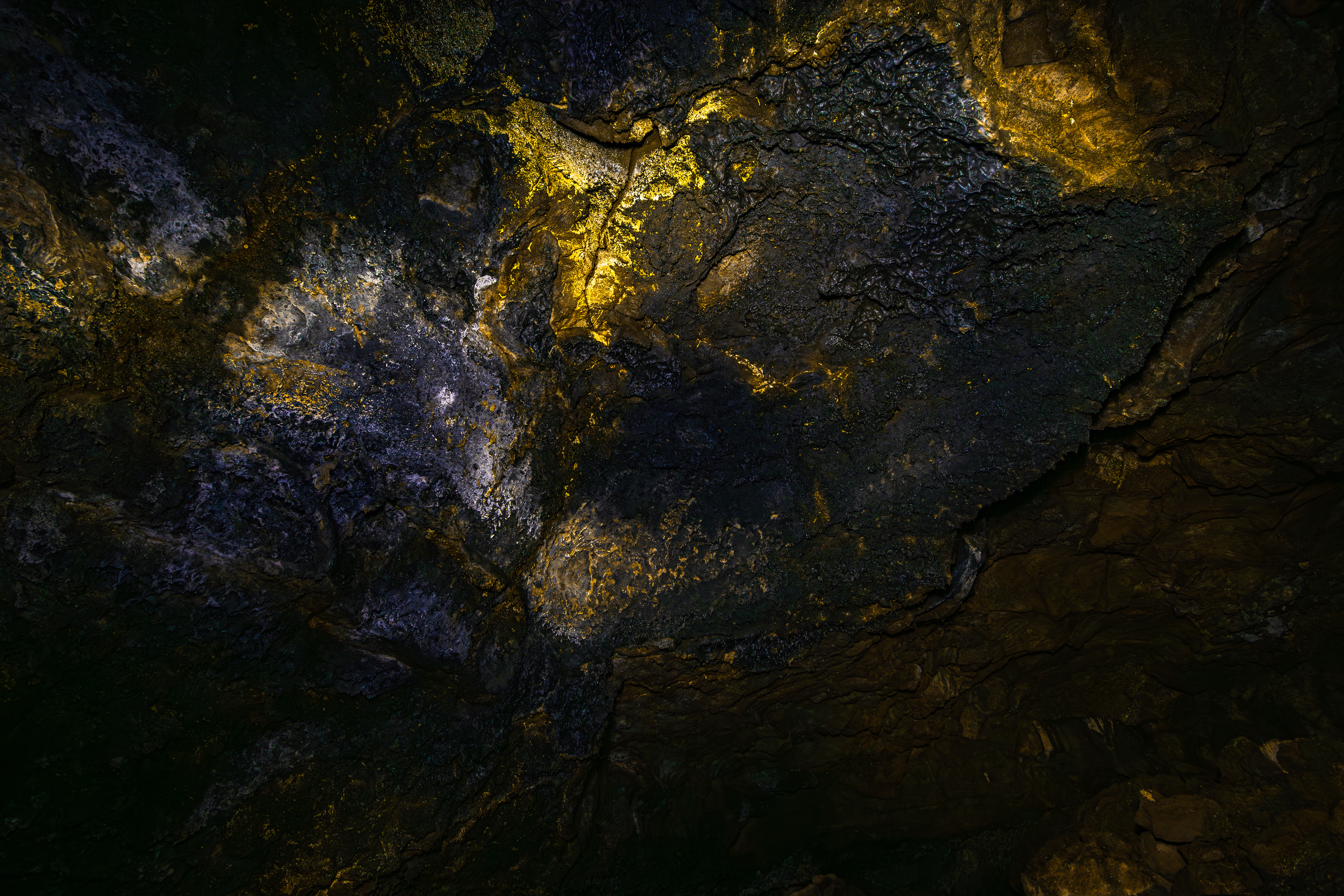 A few small pockets of the reflective, golden bacteria of the Golden Dome Cave