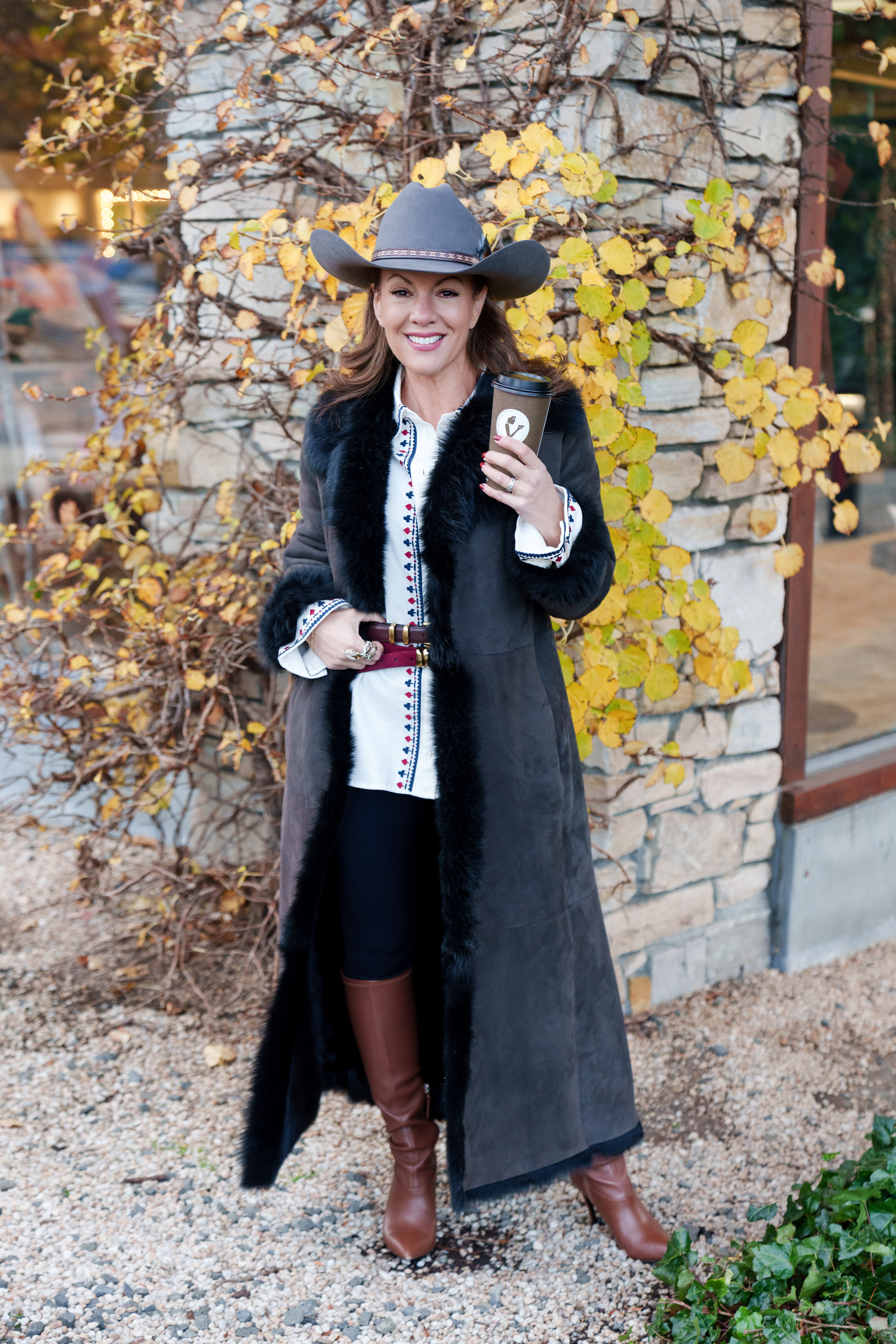 Pologeorgis Montana ranch look, with Tina wearing long coat and cowgirl hat